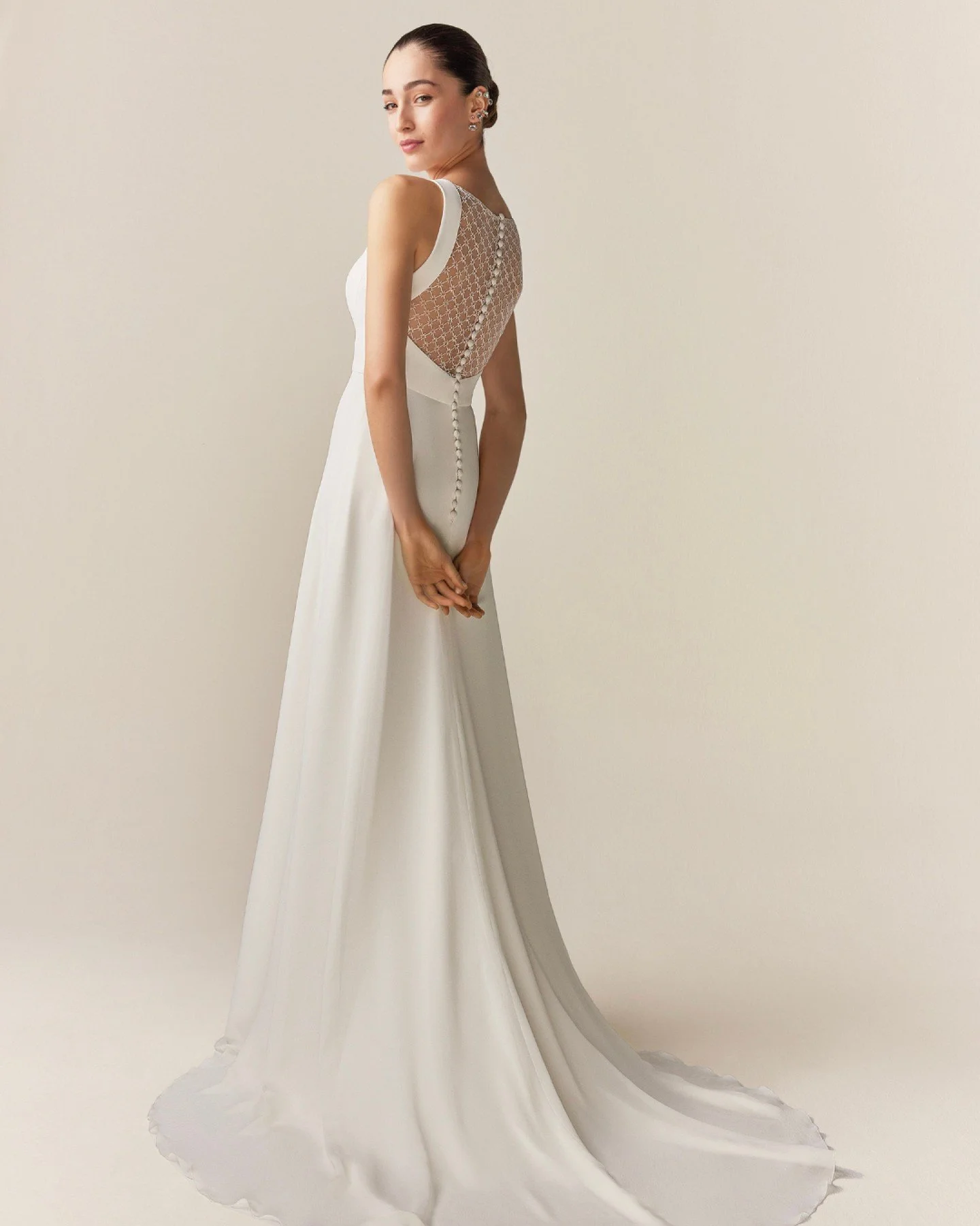 Meet Jes&uacute;s Peir&oacute; 2526: a relaxed modest, soft-slim A-line wedding dress in smooth crepe for a flawlessly balanced silhouette. The embroidered tulle lattice back adds a modern touch, simple timeless, elegant.

Book your appointment today