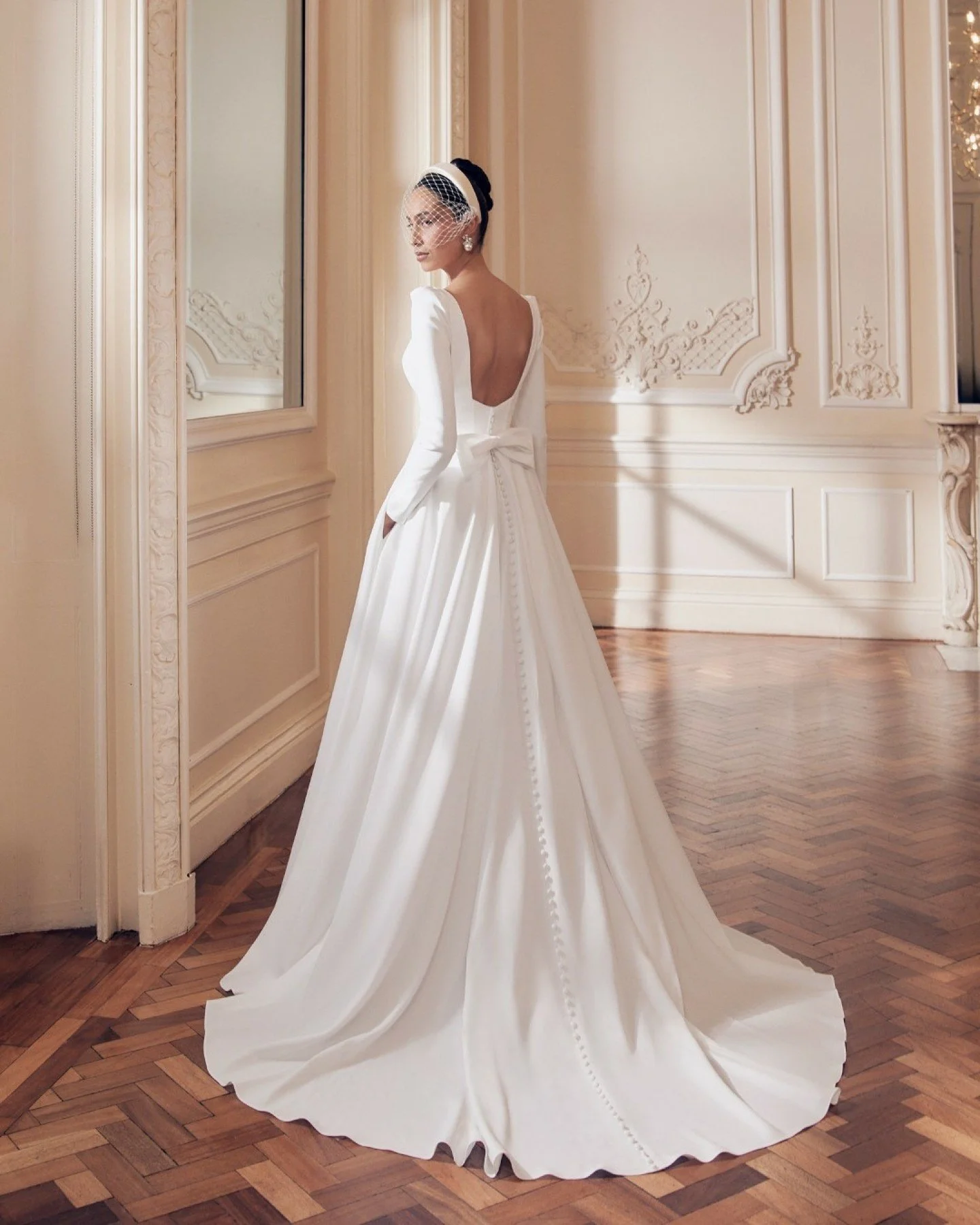 Meet Clementine by @ellisbridals &mdash; minimalist in spirit, romantic in detail.

Designed in a slim A-line crepe, Clementine features exposed boning that subtly sculpts the bodice and enhances natural curves, paired with fitted sleeves for a clean