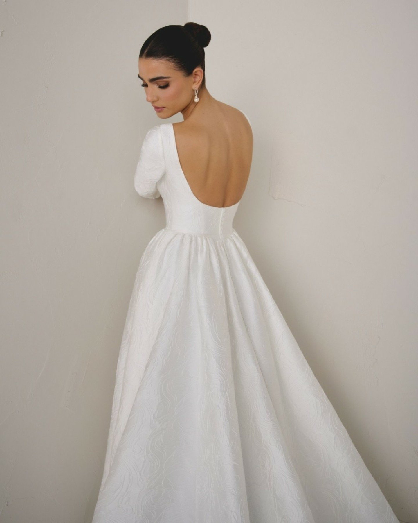 There&rsquo;s something incredibly special about a gown that feels both classic and modern at the same time. Calista by Justin Alexander Signature has that presence &mdash; beautifully tailored in brocade (Plain satin also available), with a clean Sa