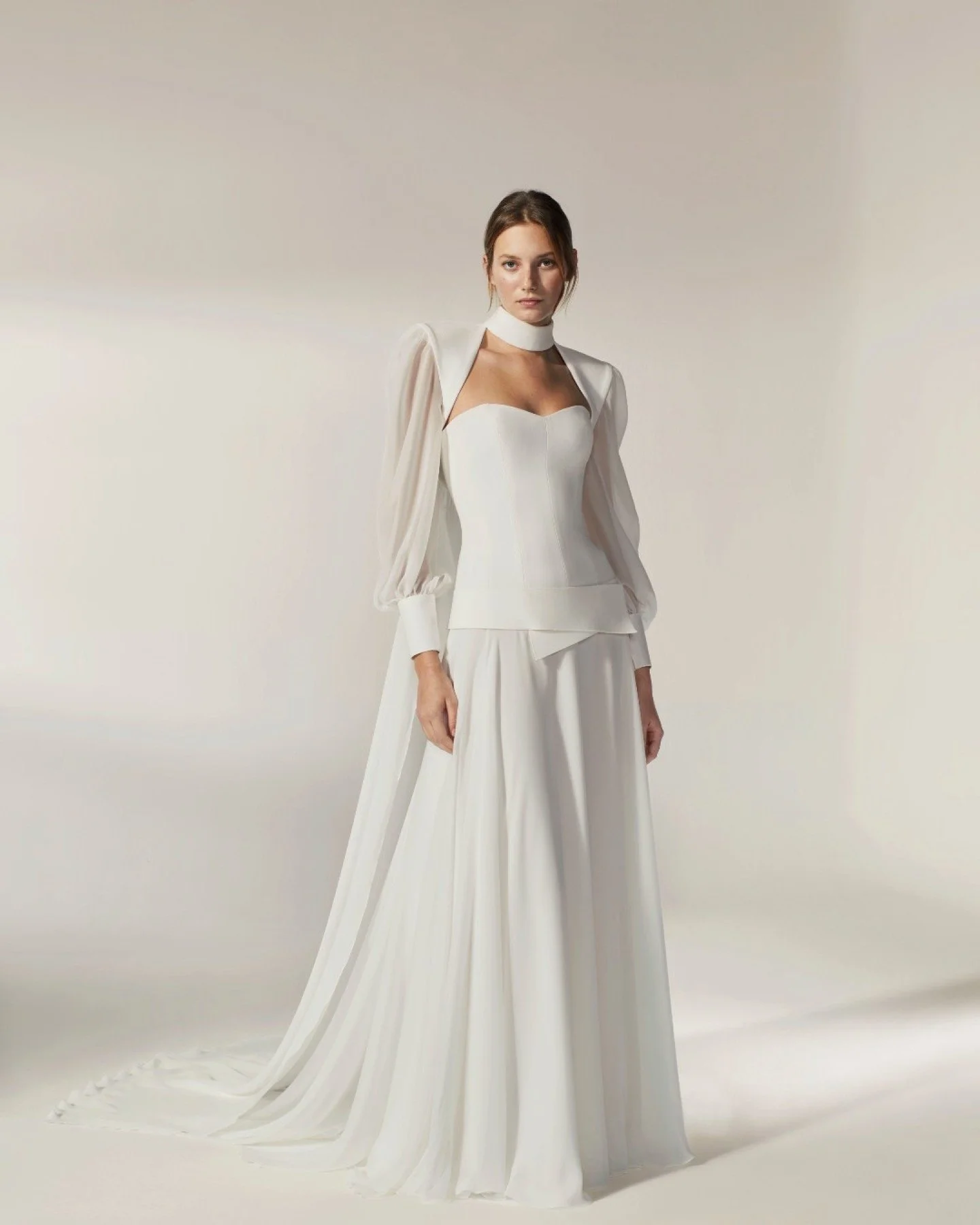 Jesus Peiro 2600

Minimal doesn&rsquo;t have to mean one-note.

2600 is a beautifully structured strapless wedding dress with a soft, flowing chiffon skirt &mdash; clean, modern and quietly confident. But the magic is in the styling.

Add the matchin