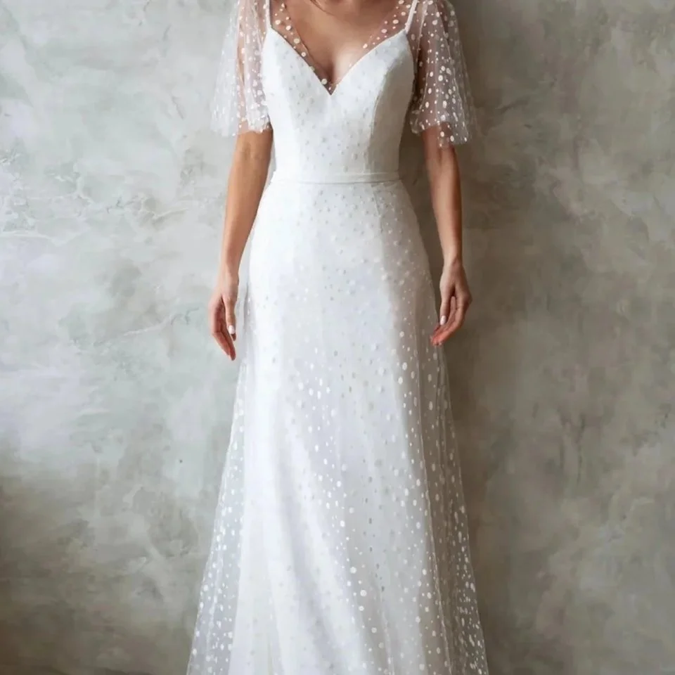 Dress: Lilian
Designer: Love and Liberty Bridal
Size: 12
Condition: As New
Price: &pound;195 was &pound;1900

The Lilian dress by Love and Liberty Bridal is a lovely alternative to the traditional wedding dress. A fitted dress with a polka dot tulle 