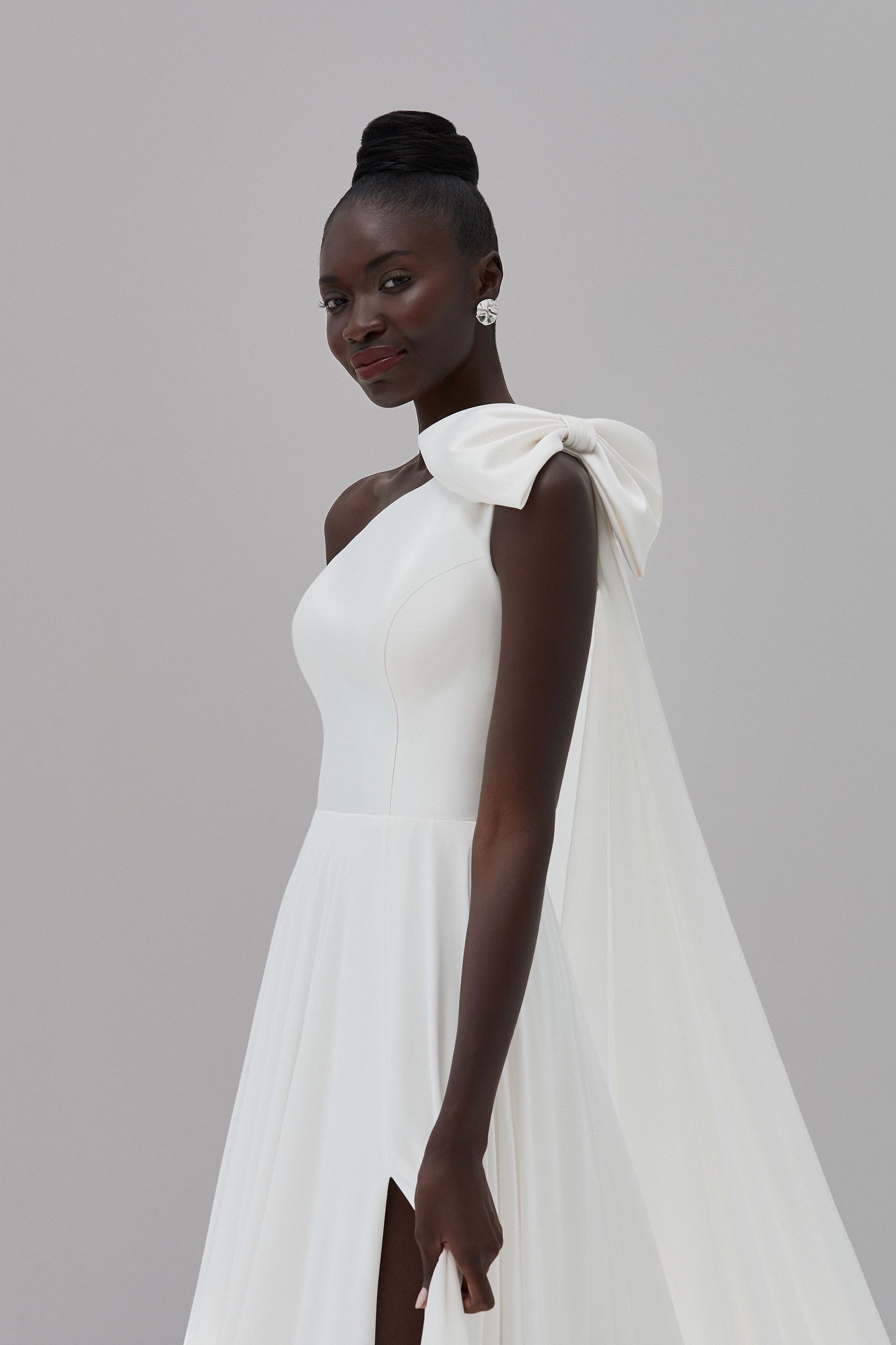Gramercy by Justine Aleander, Mikado and Chiffon wedding dress with split in plus size. Buy online from & Wolf Bridal