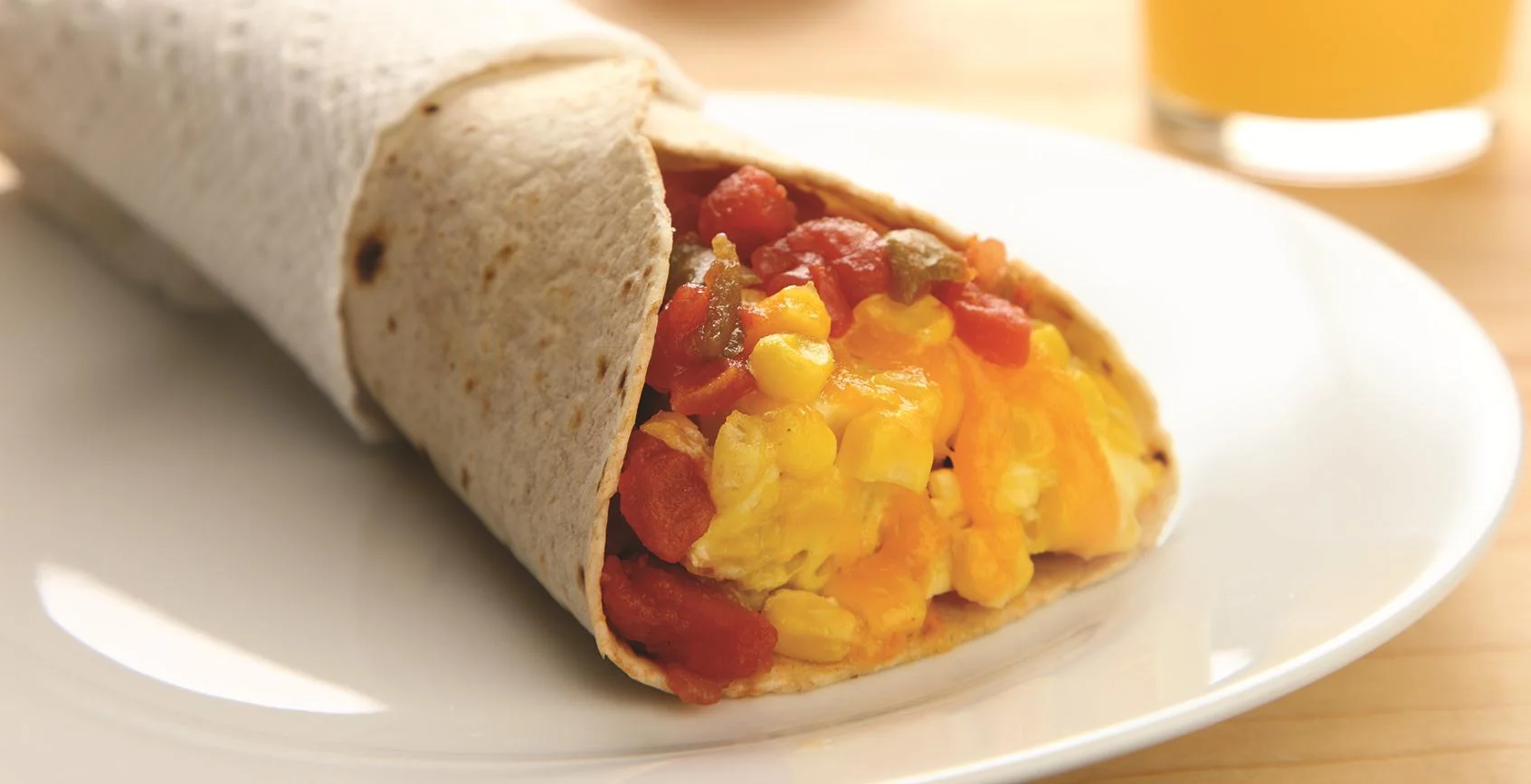 Hash Brown Scramble Burrito (no meat): A hearty morning meal of crispy Hash Browns, scrambled eggs and a blend of Monterey Jack and Cheddar cheeses. Made fresh each morning. Rolled in a warm flour tortilla. Served with Salsa.