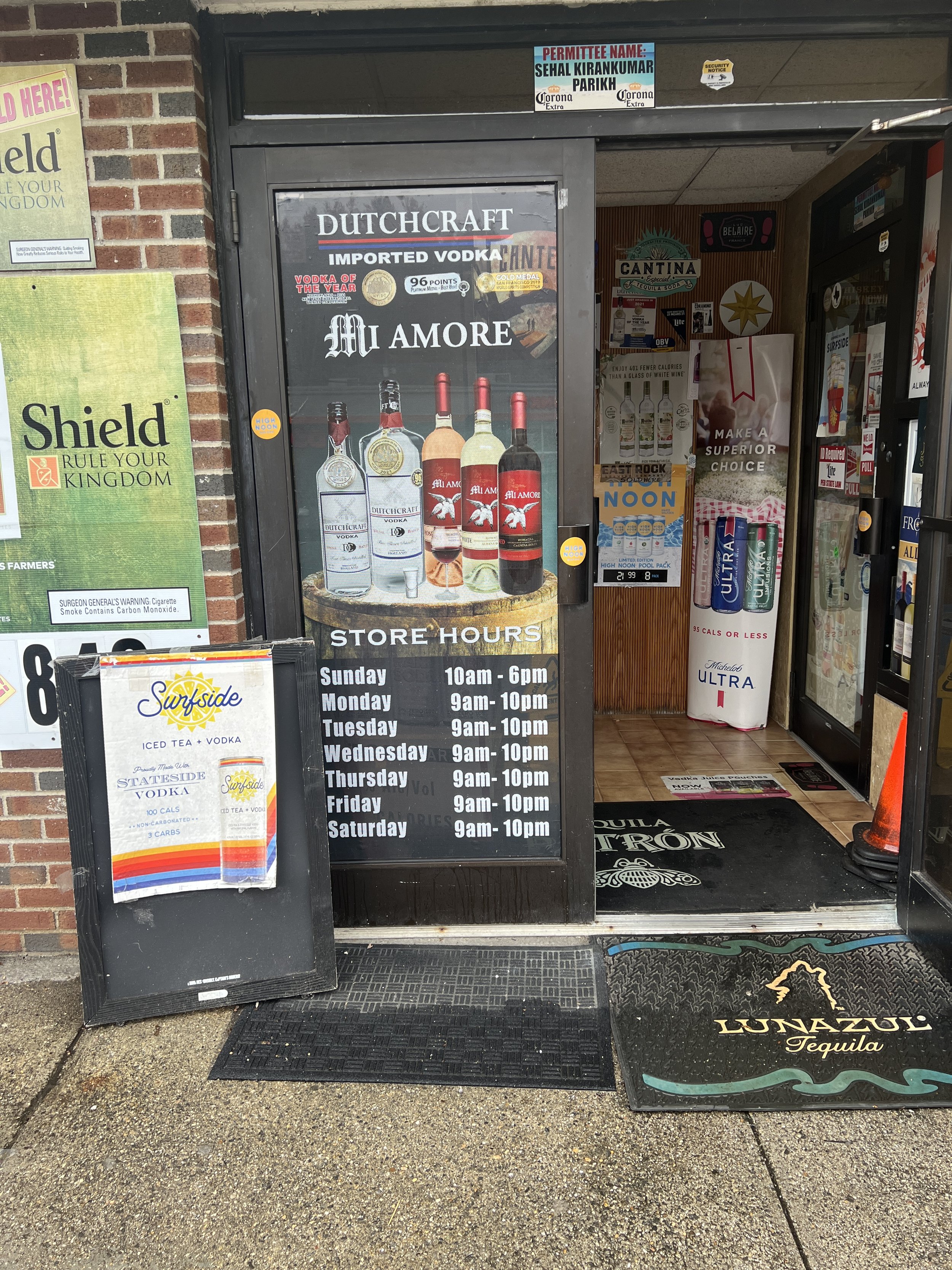 Mesh door sign for local Liquor store