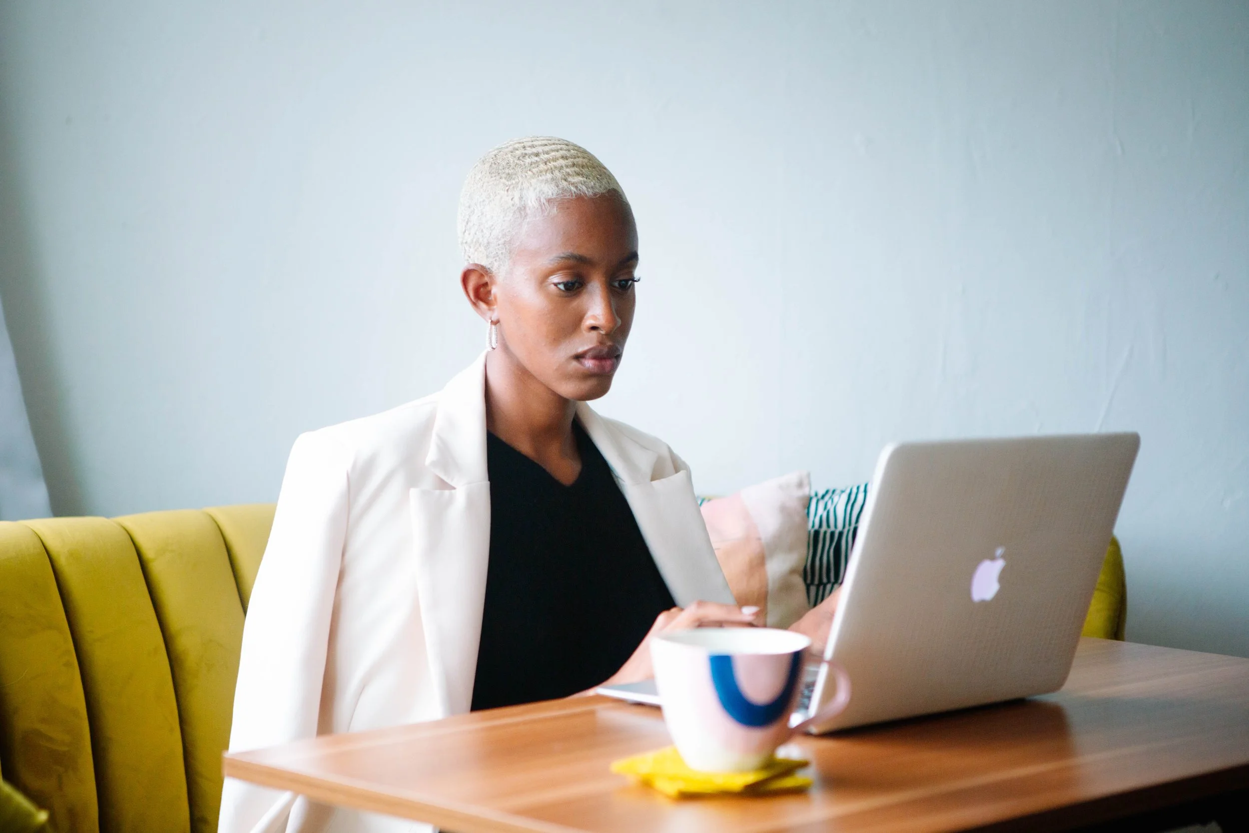 A YBH Member in the coworking space on the laptop.