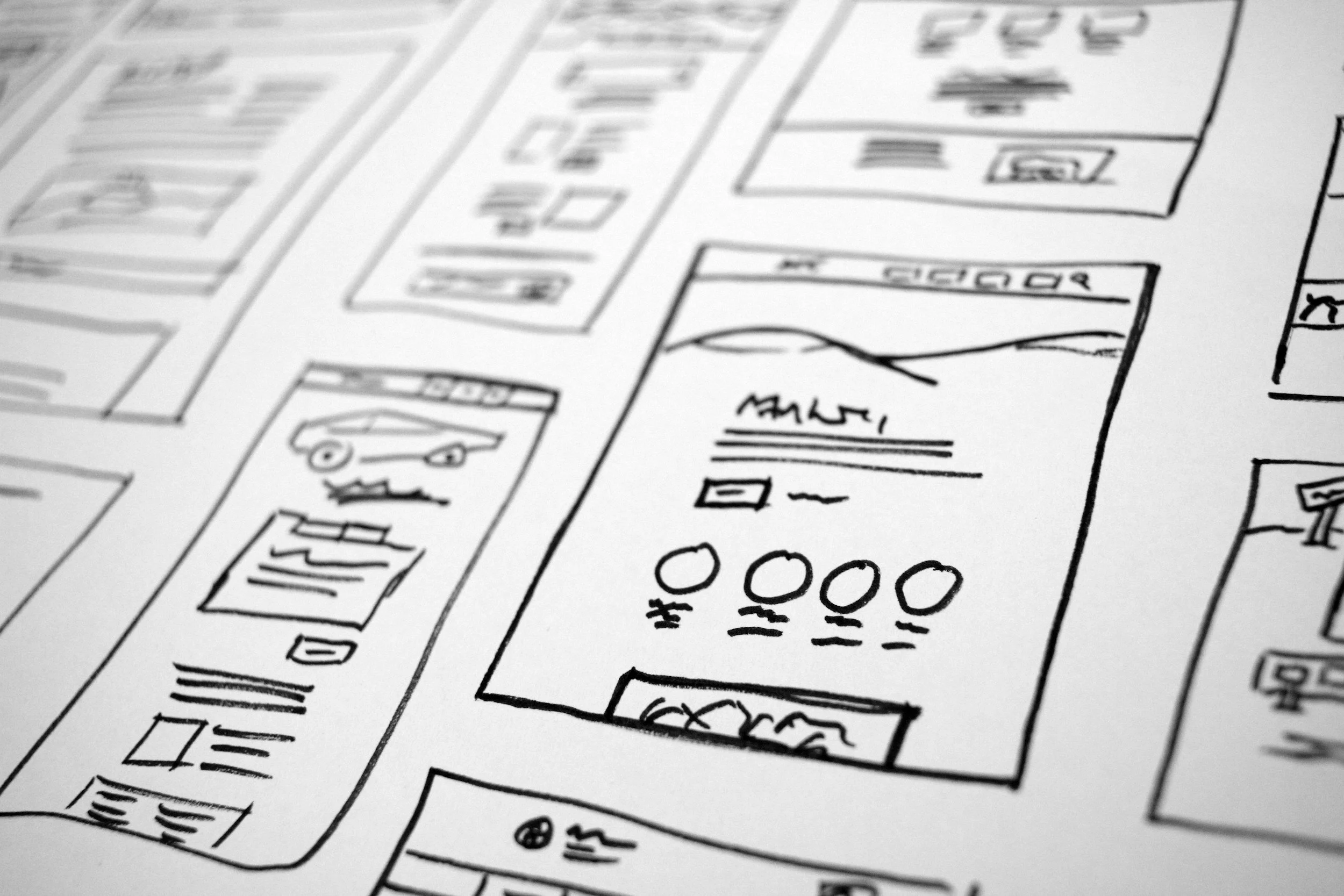 Hand drawn wireframes on paper