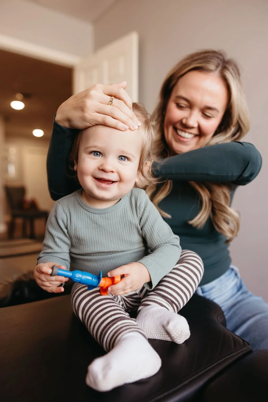 Women adjusting baby for ear infections and sinus issues in East Nashville Tennessee.