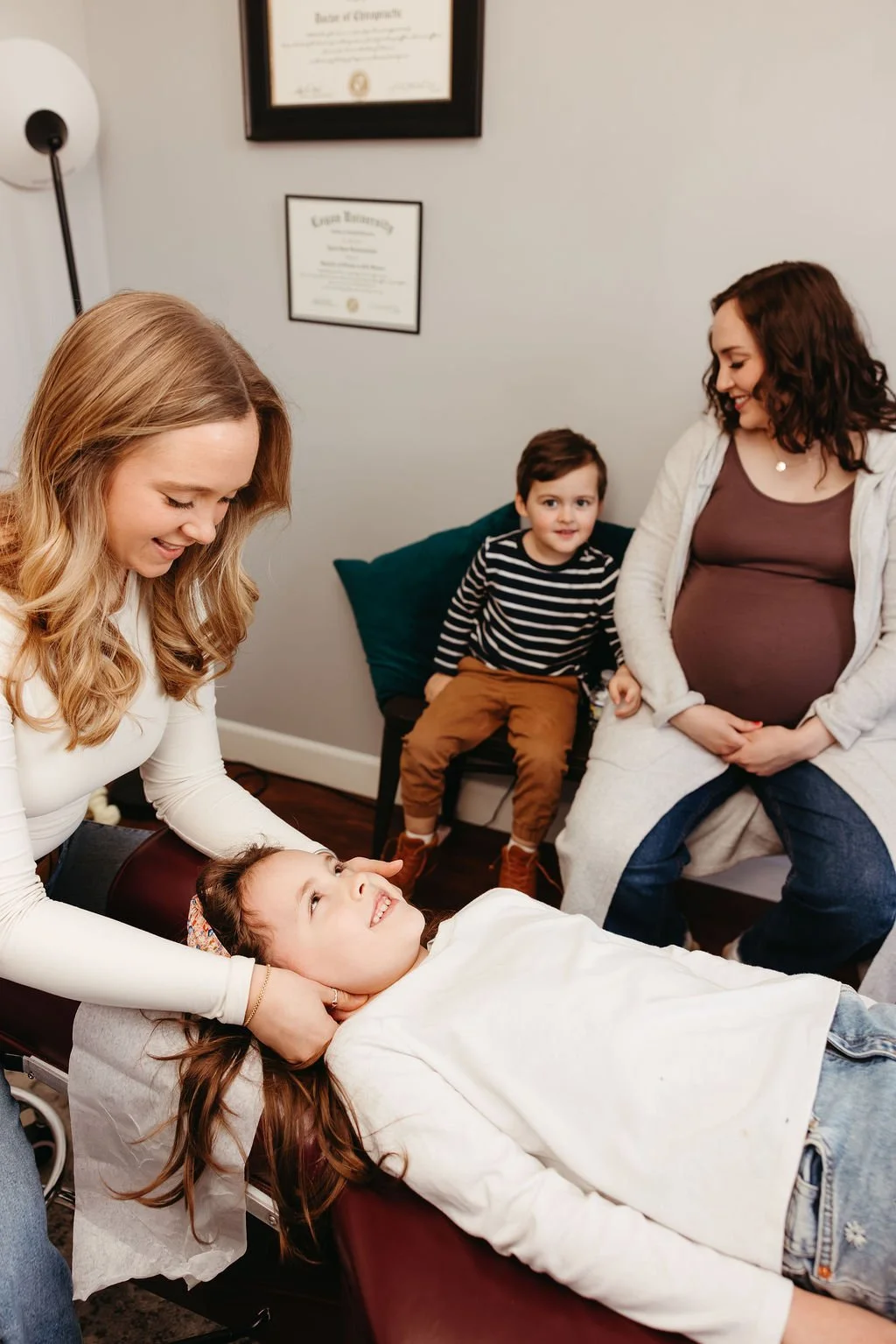 Female Doctor adjusting child to support ADHD, Sensory process, and Sleep issues in Nashville Tennessee.