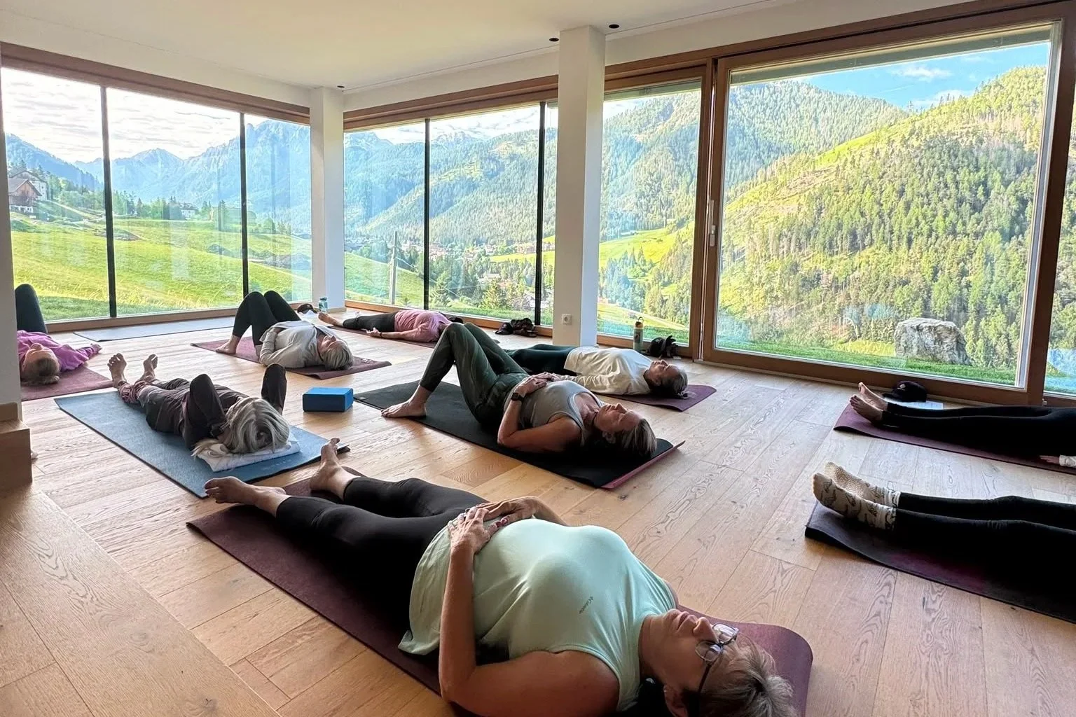 Yoga practice with panoramic views of the Dolomite mountains