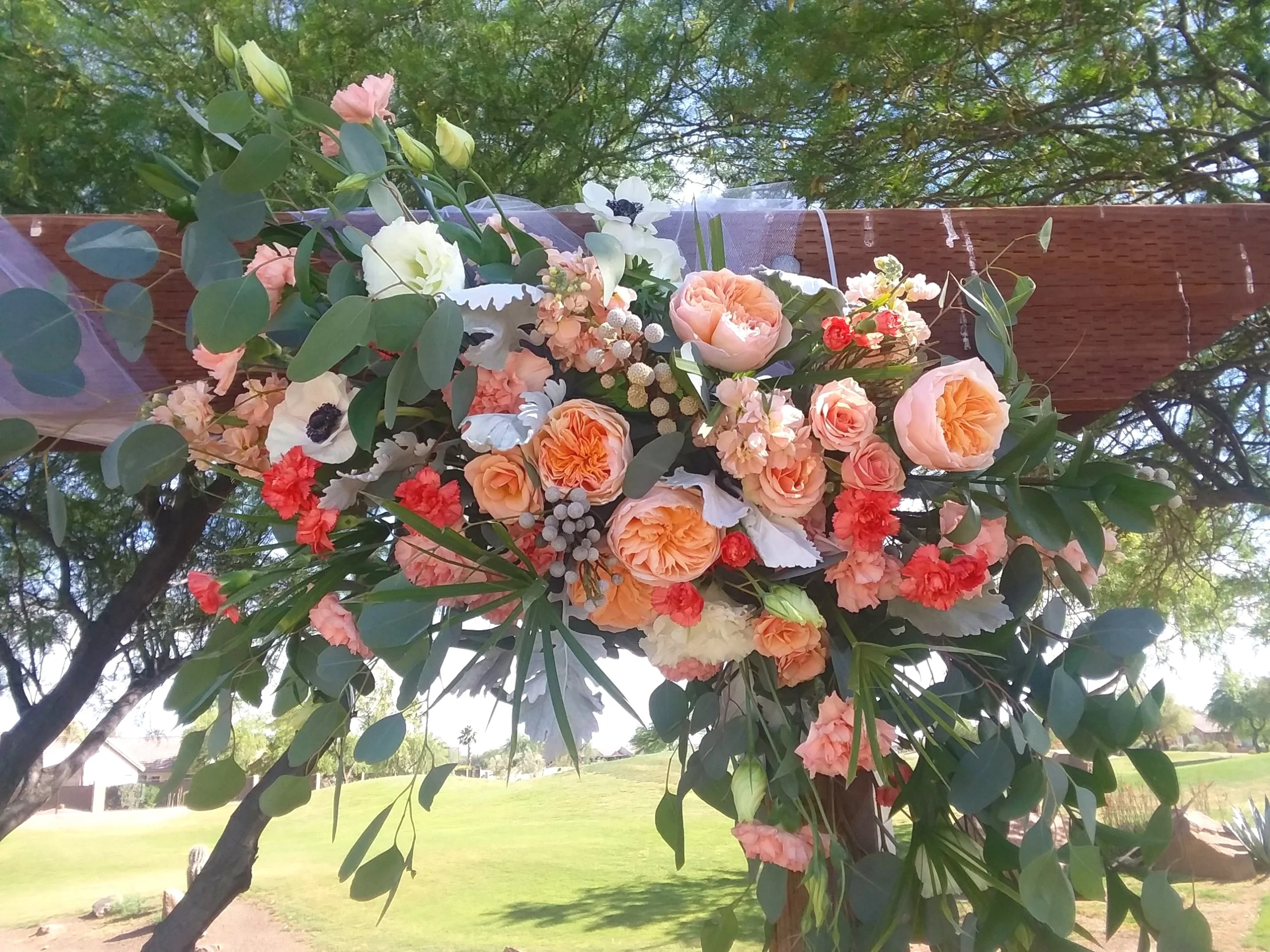 Peach floral wedding arch swag
