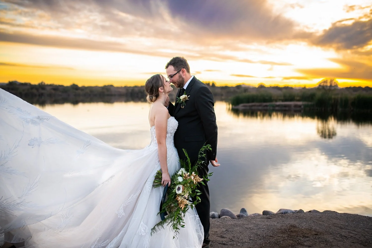 bride and groom at sunset