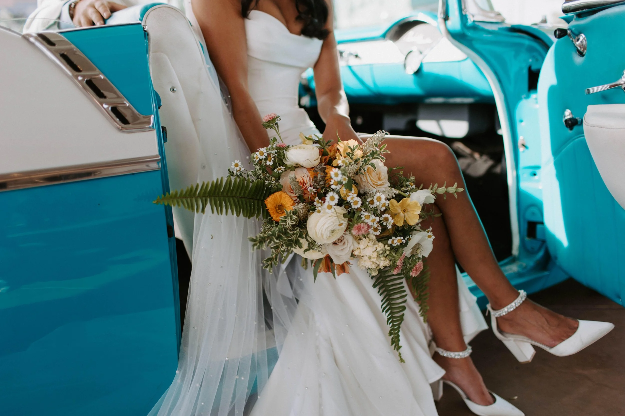 Bride with classic car