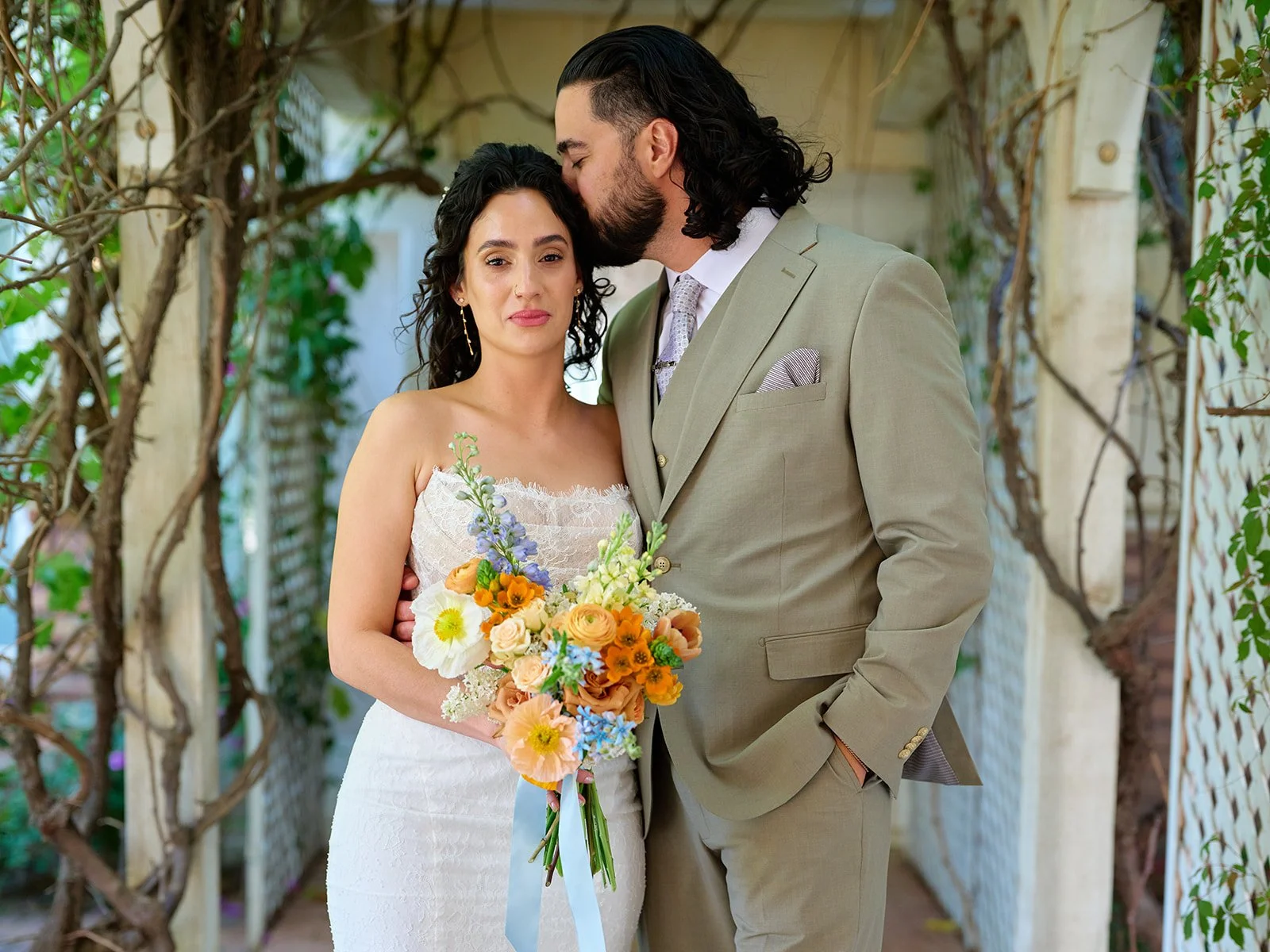 Beautiful bride and groom at whimsical garden wedding