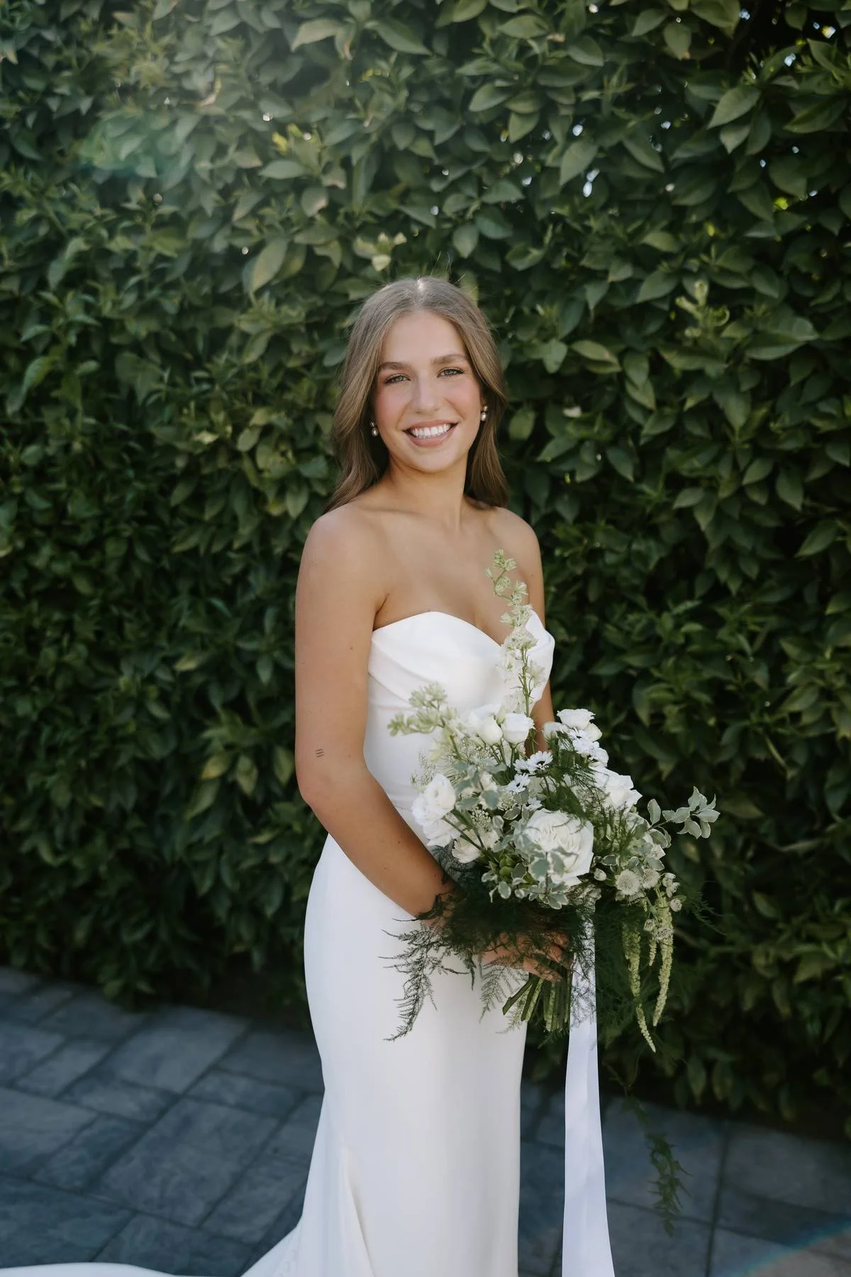 Bride with green and white bouquet