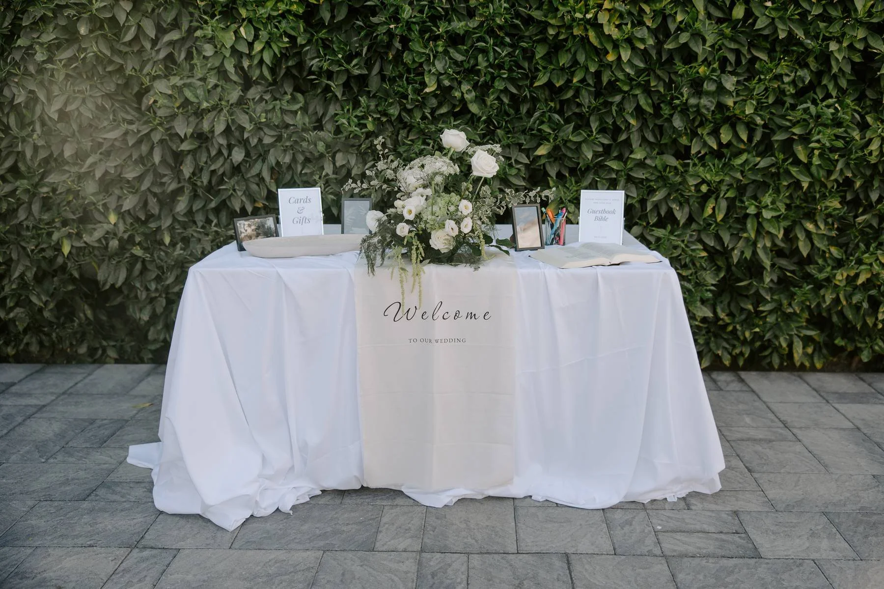 Garden style guest book table florals