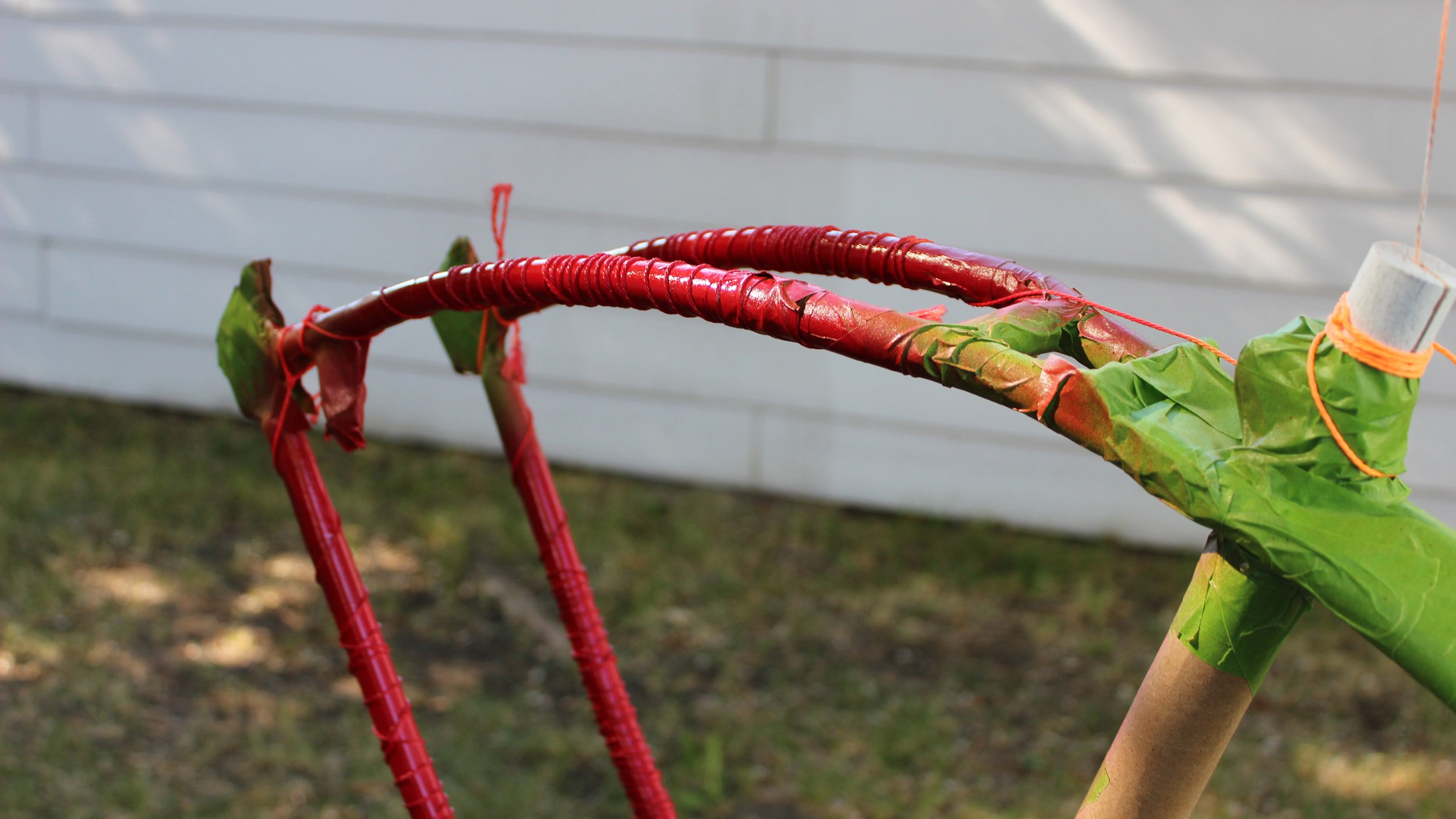 The Little Red Bastard bicycle getting painted
