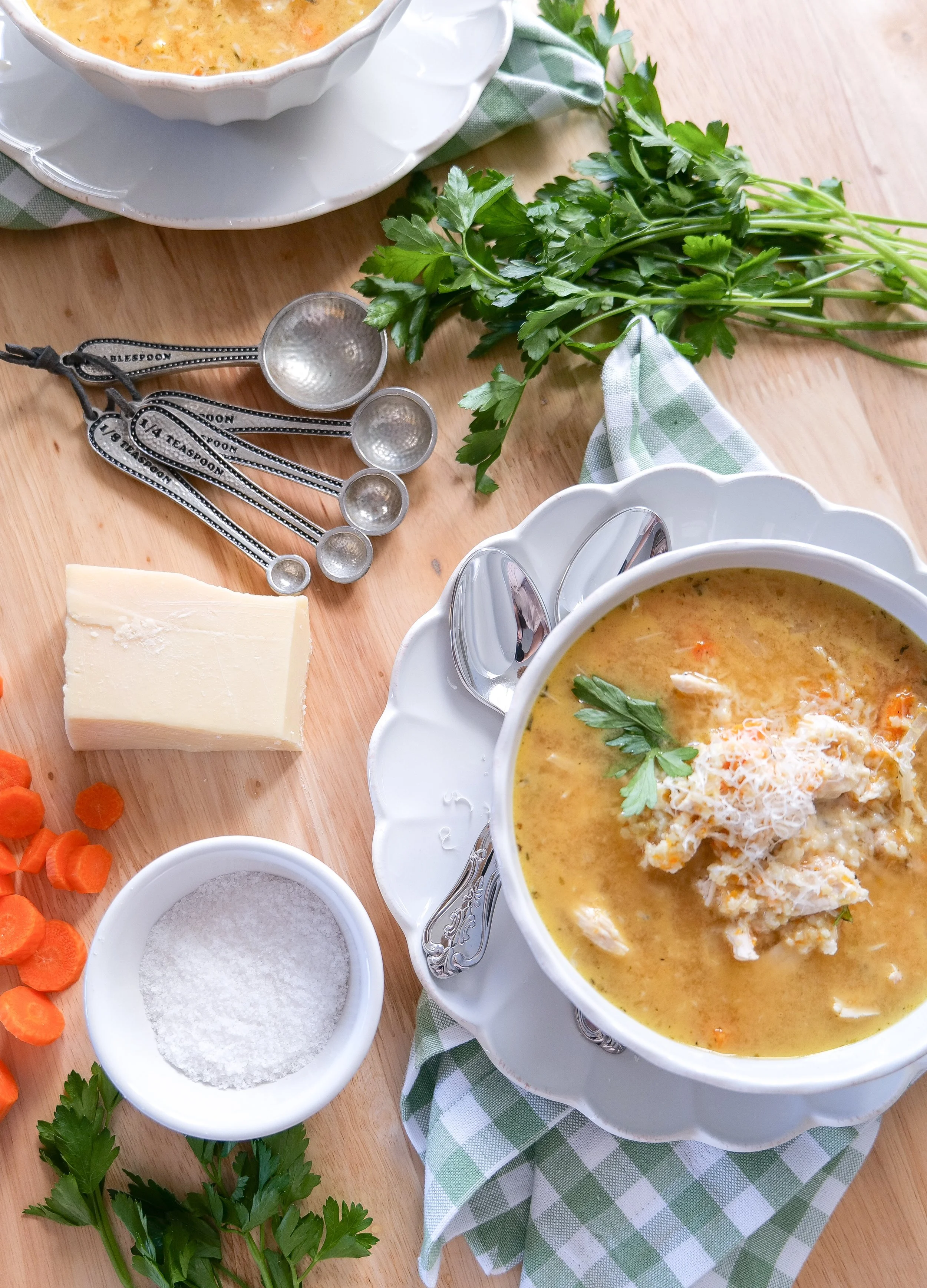 Warm bowl of cozy Italian chicken soup with pastina, carrots, celery and fresh Parmesan.