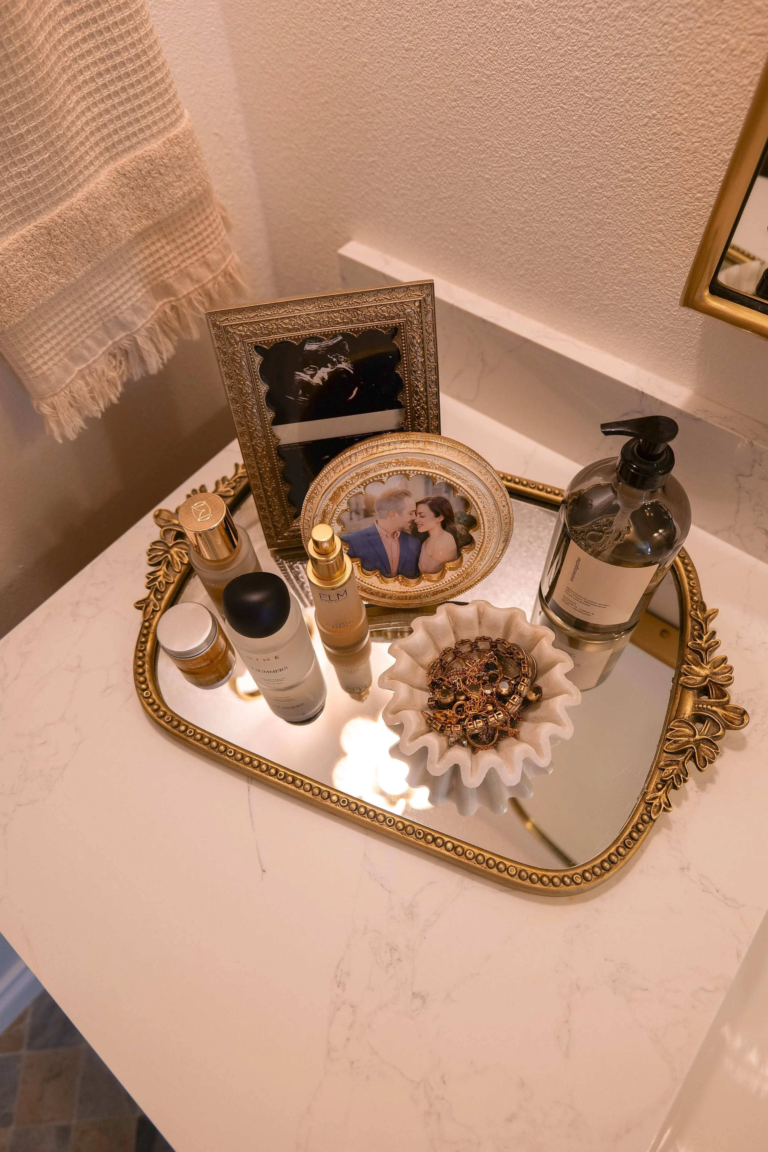 Bathroom vanity countertop with decorative accessories in our coastal bathroom.