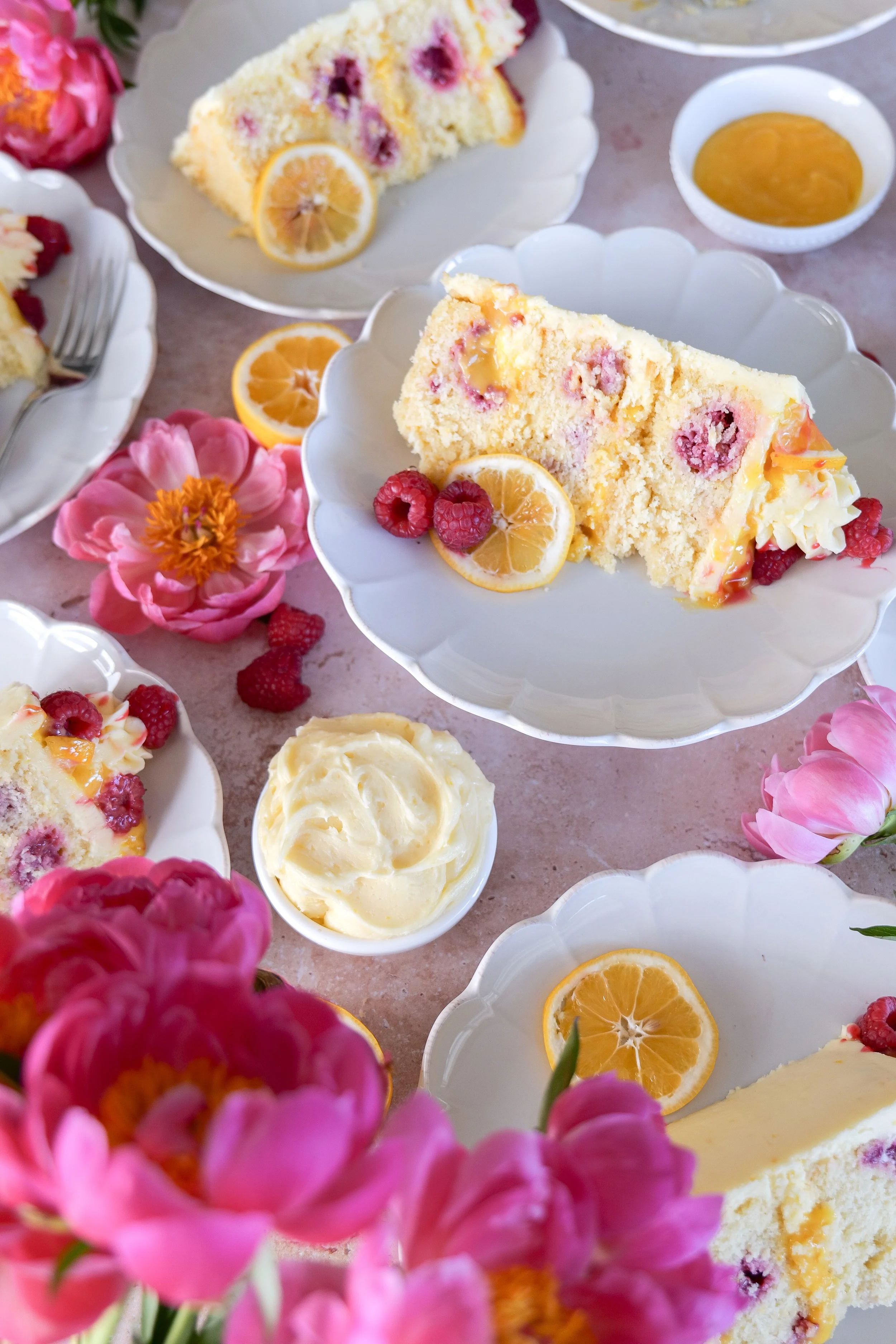 Lemon cake showing creamy lemon curd filling between layers.