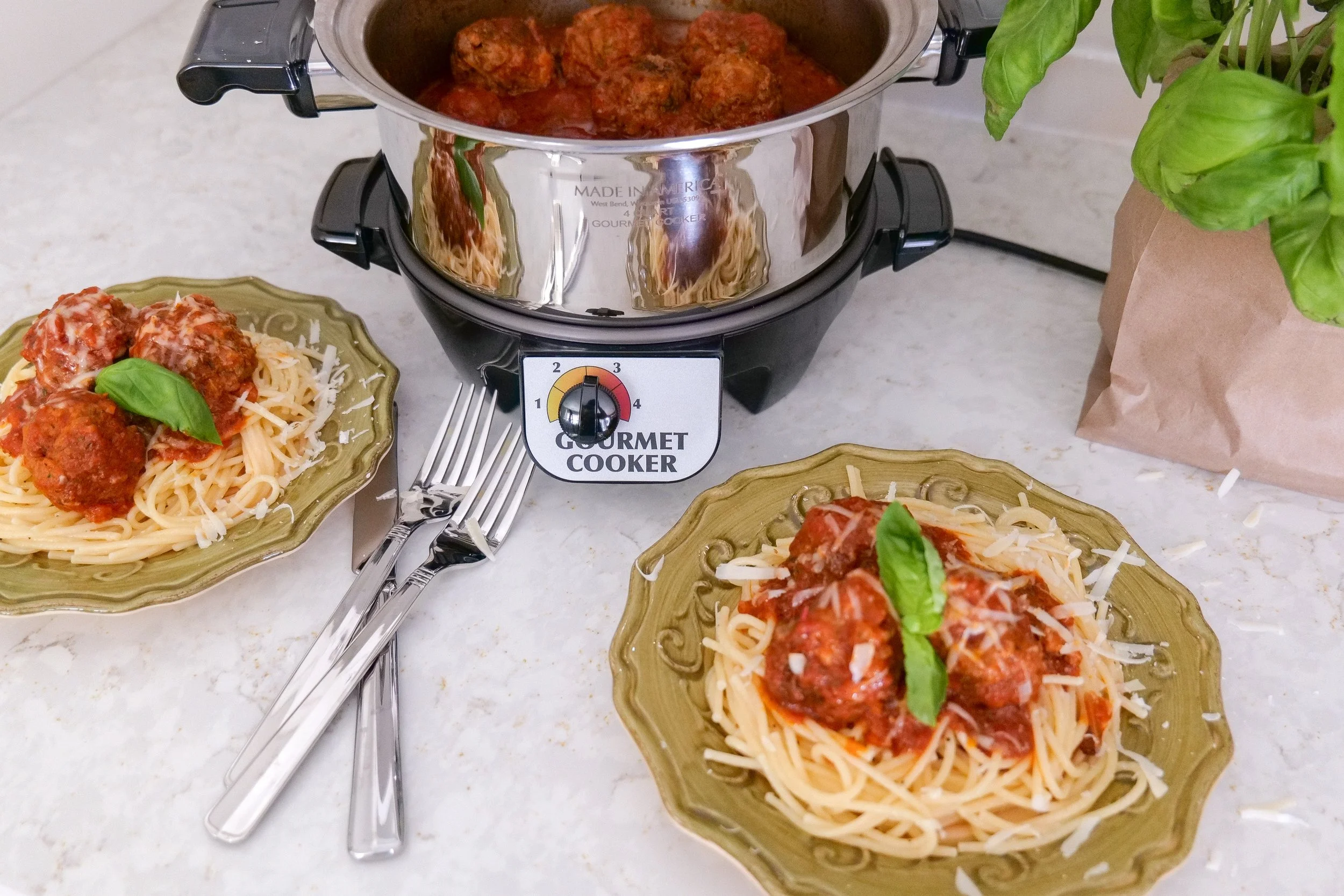 Family style Italian meatball dinner served with pasta and marinara sauce