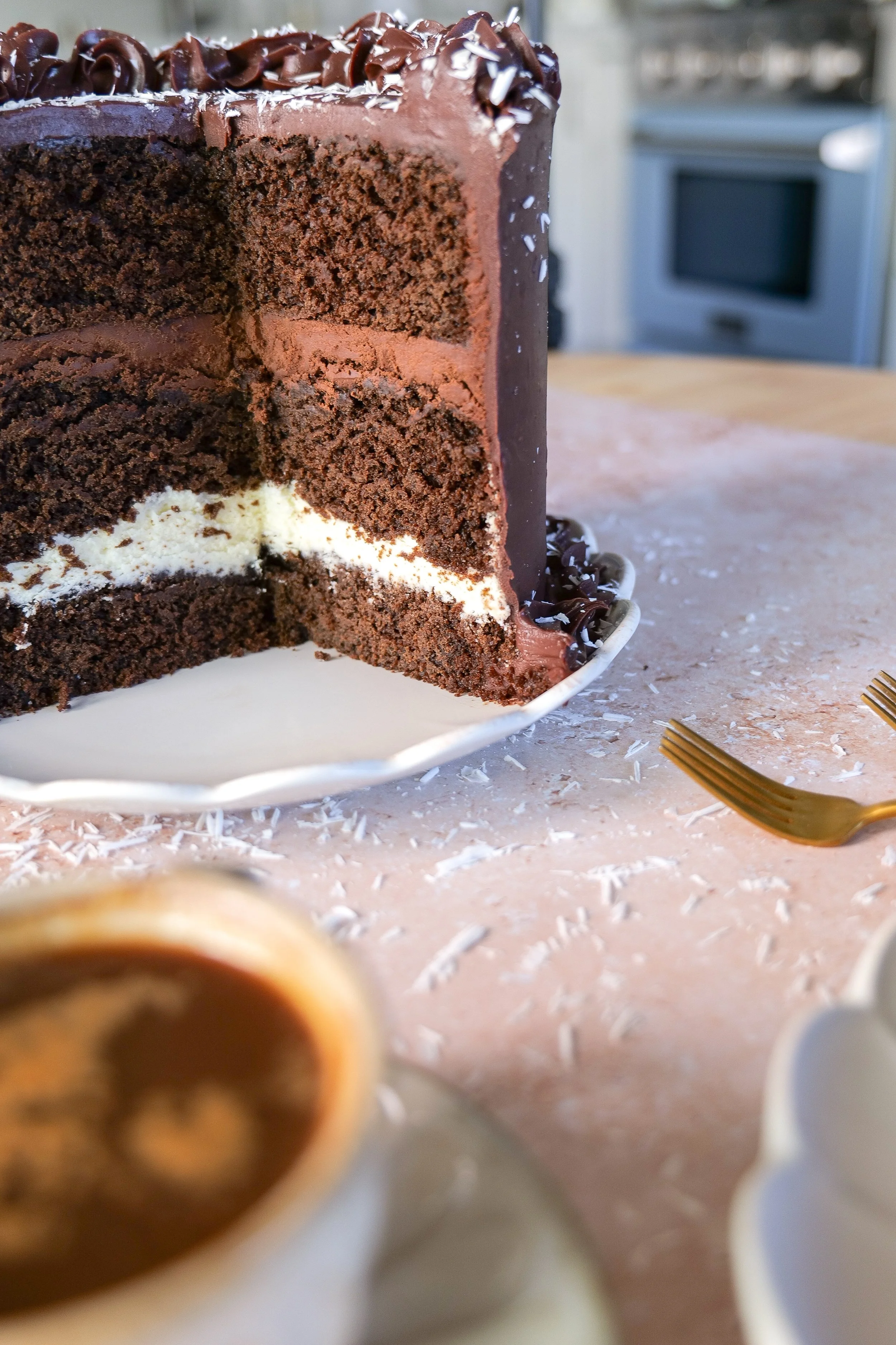 Chocolate mousse layer cake finished with rich milk chocolate ganache.