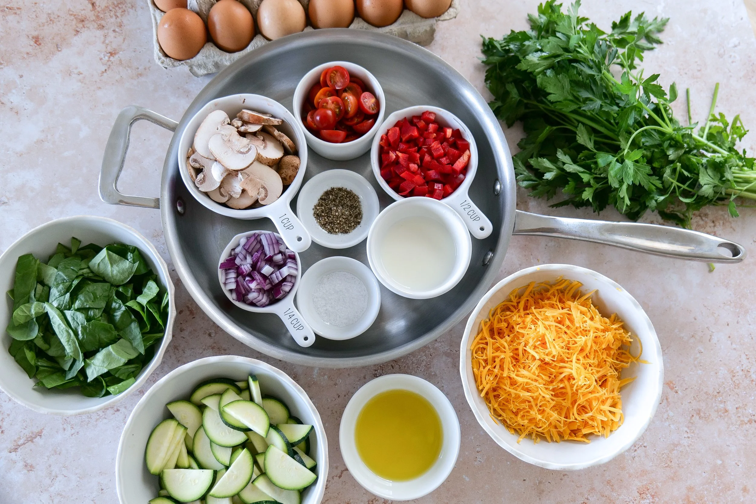 Easy egg frittata recipe with zucchini spinach tomatoes and cheese