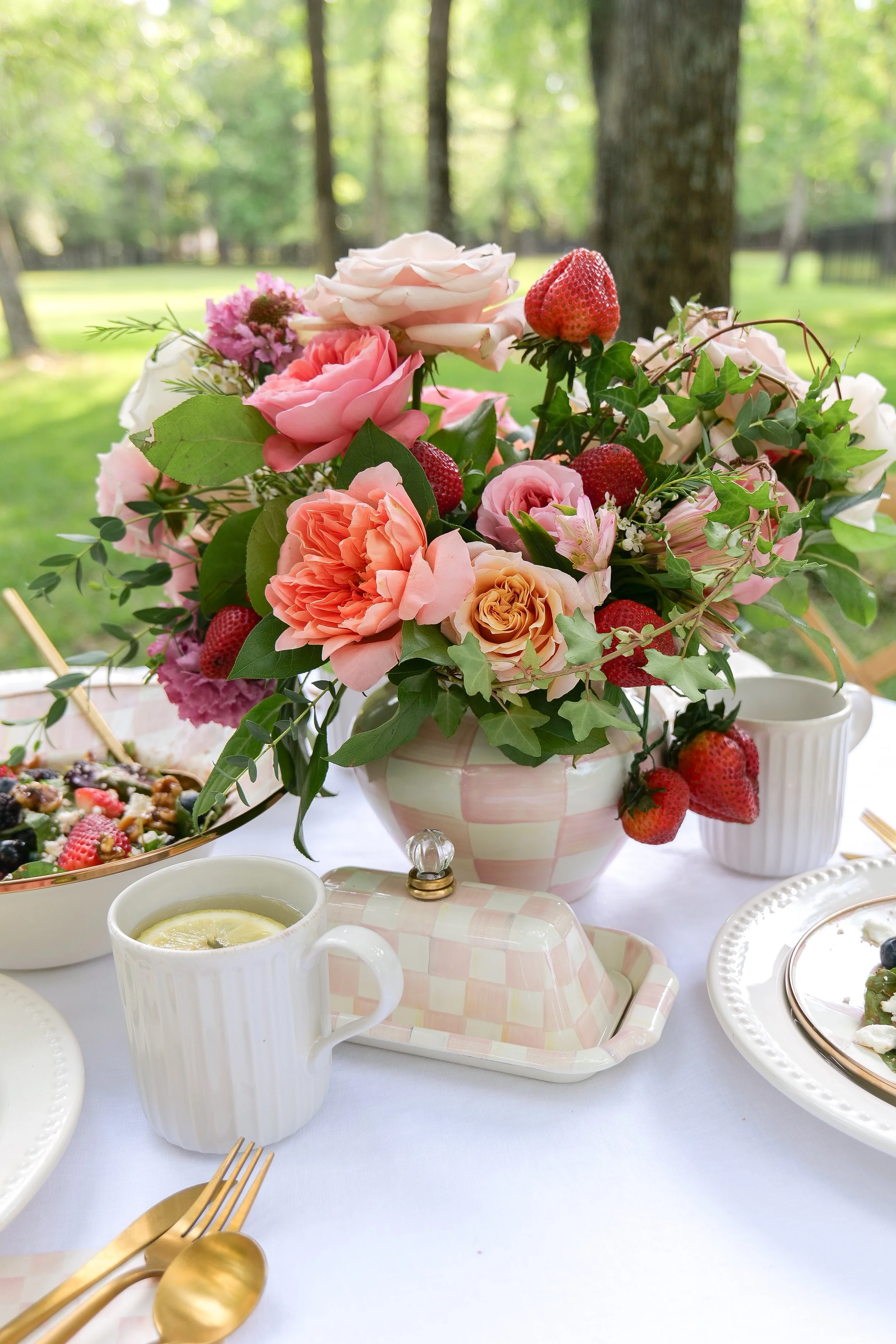 Colorful fruit tablescape with fresh fruit and floral table decor