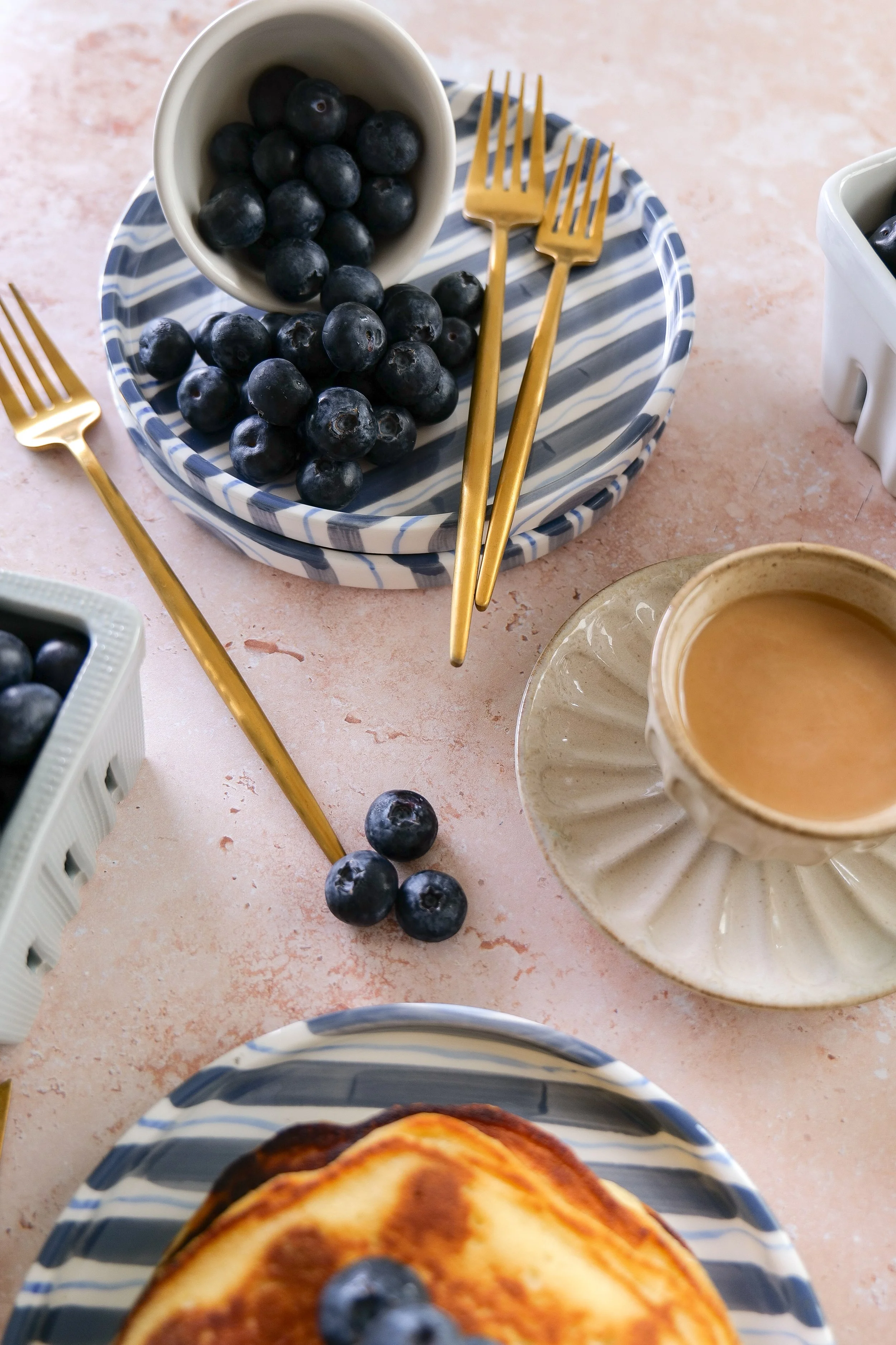 Fresh blueberry breakfast pancakes with golden edges and fluffy centers.
