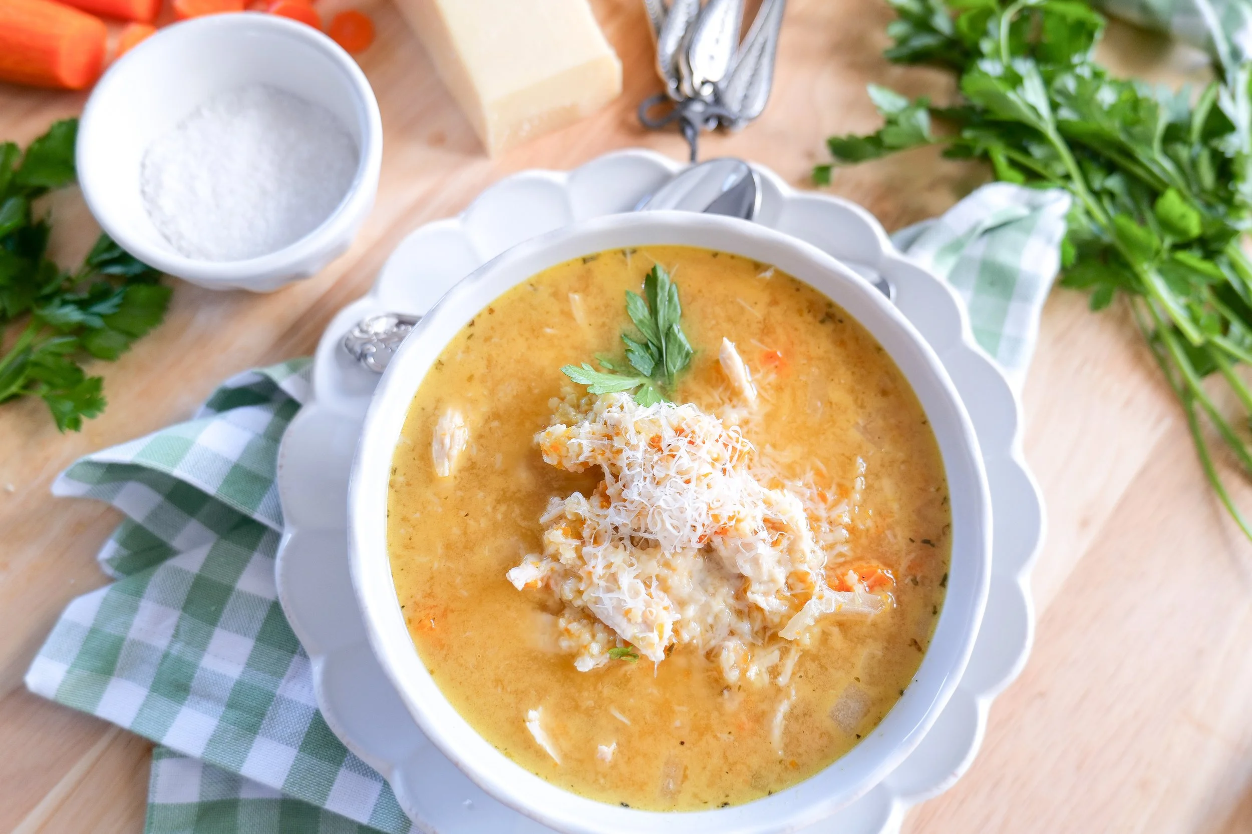 Homemade Italian Penicillin Soup served warm with chicken, vegetables, herbs and Parmesan.