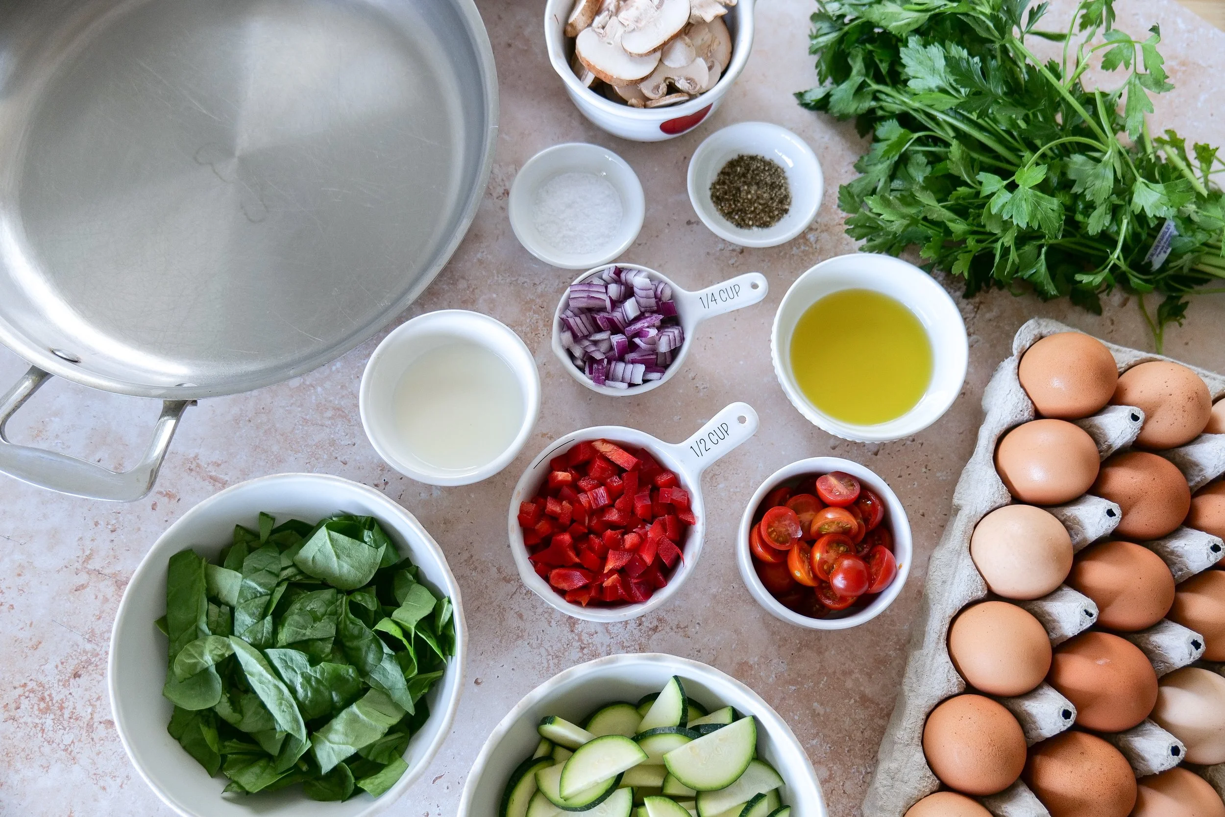 Summer farmers market frittata made with seasonal produce and herbs
