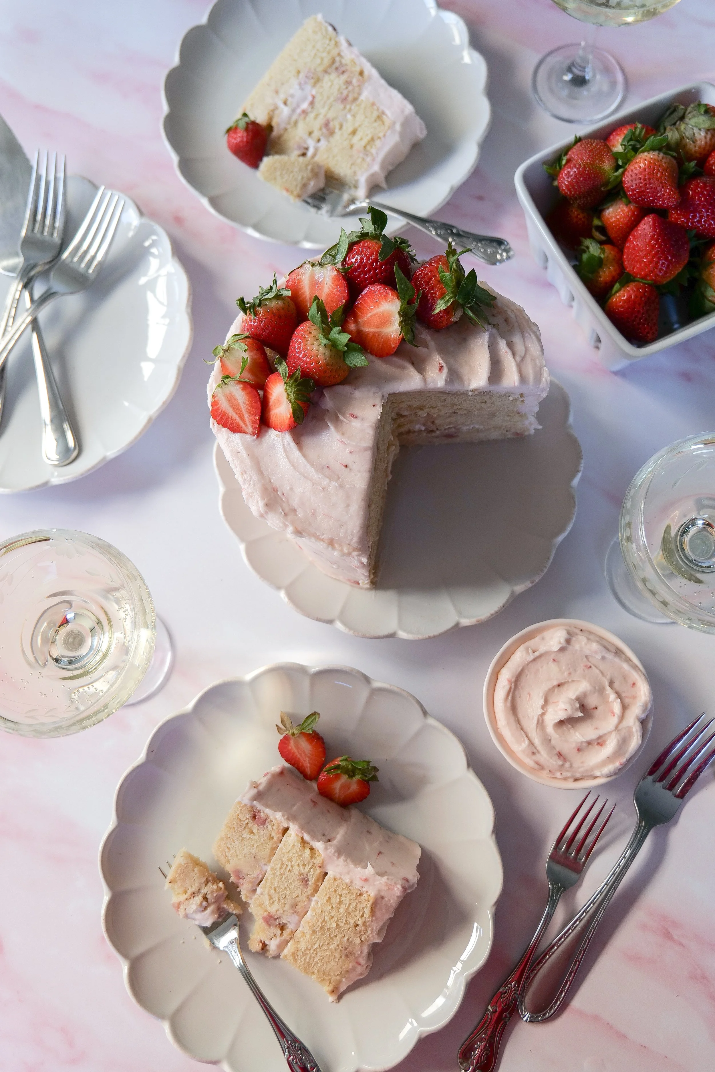 Strawberry Champagne Cake with three layers and creamy strawberry champagne cream cheese frosting.
