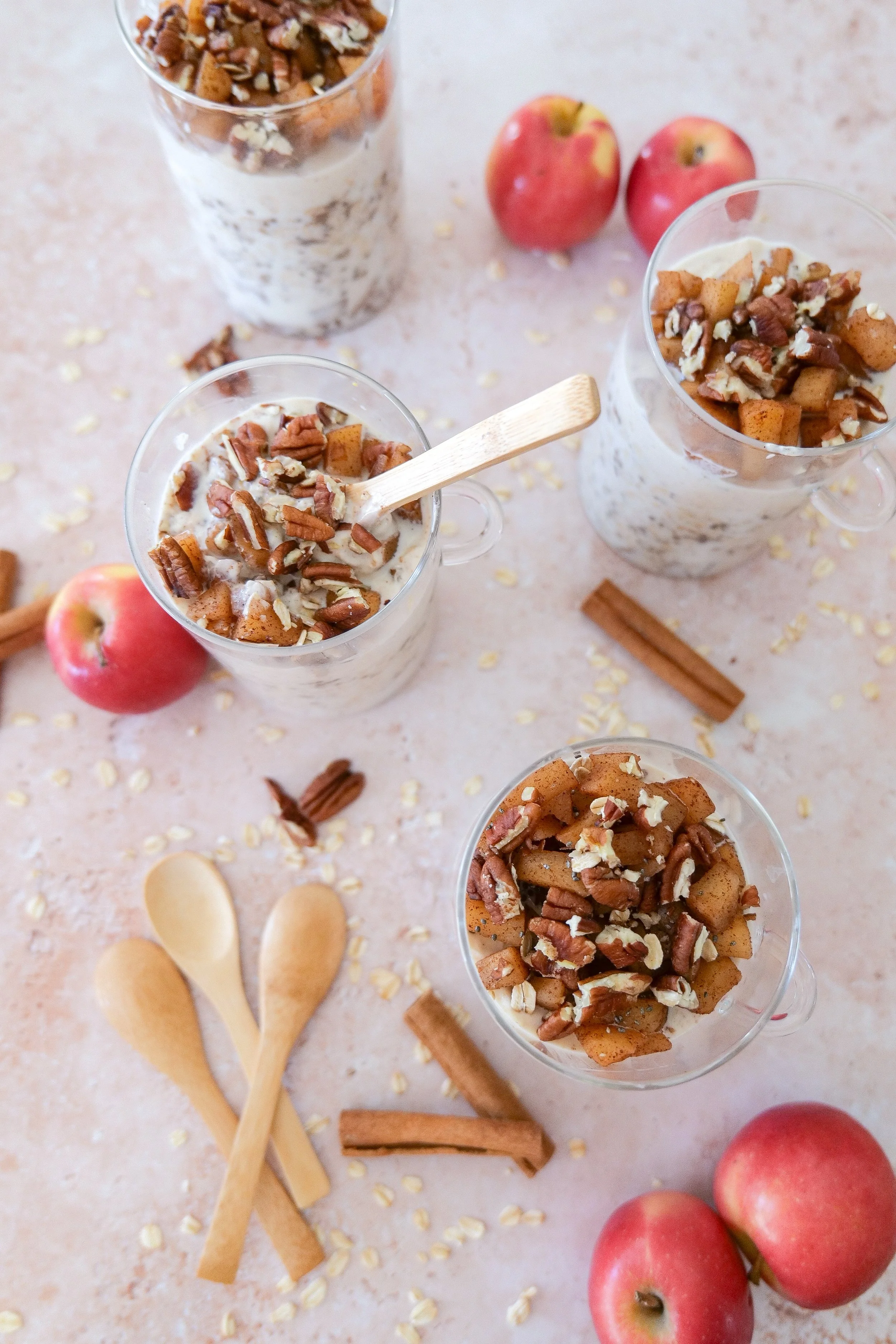 Fall overnight oats with tender cinnamon apples and a creamy yogurt layer.