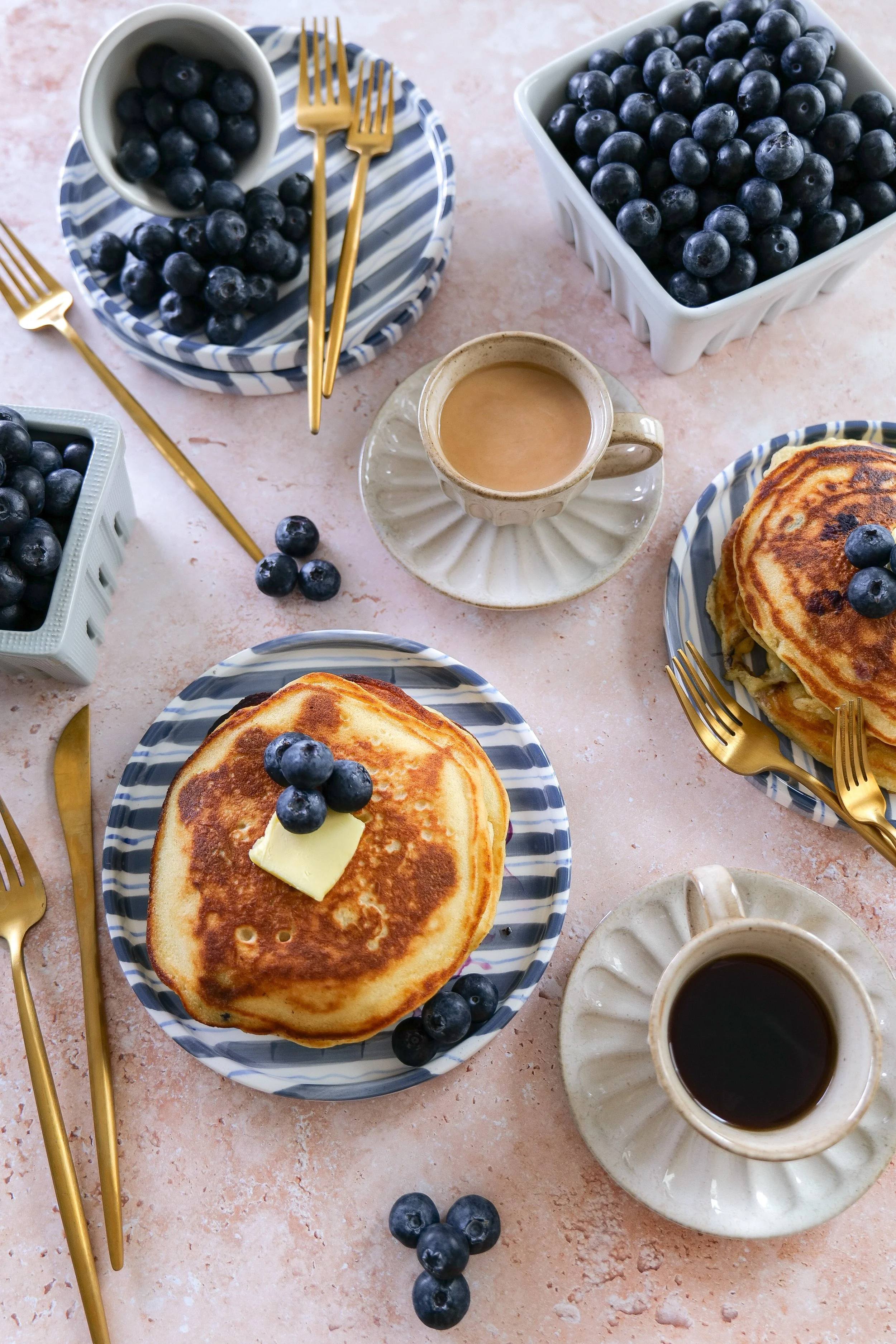 Fluffy blueberry sourdough discard pancakes with maple syrup.