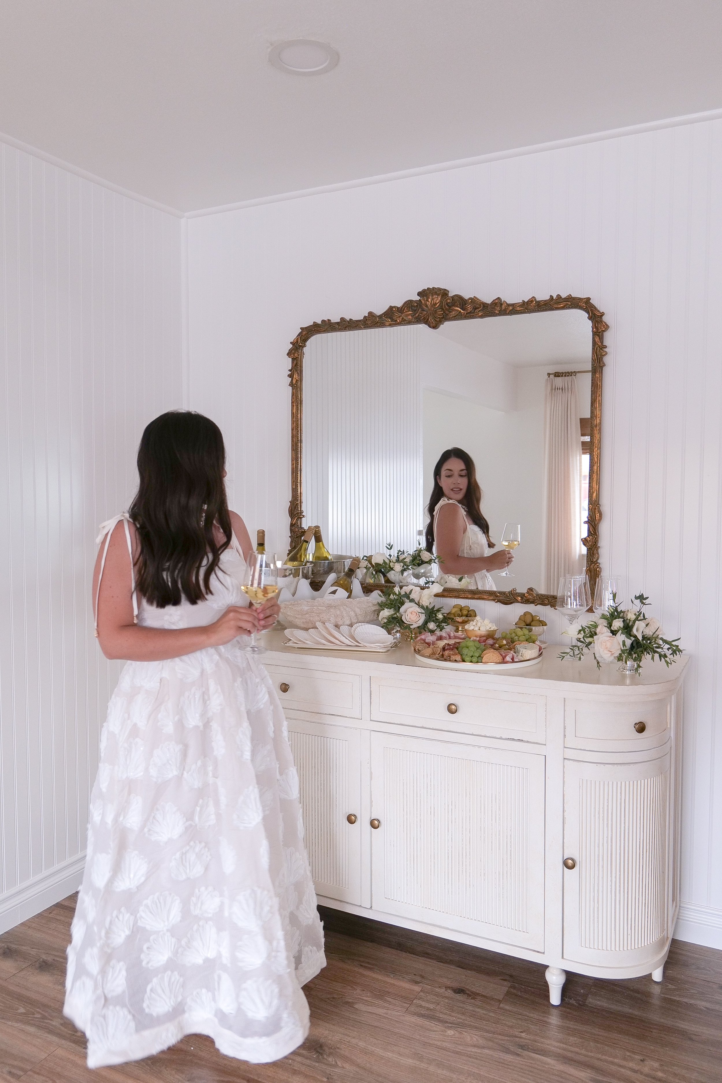Elegant summer dinner party outfit styled for coastal entertaining