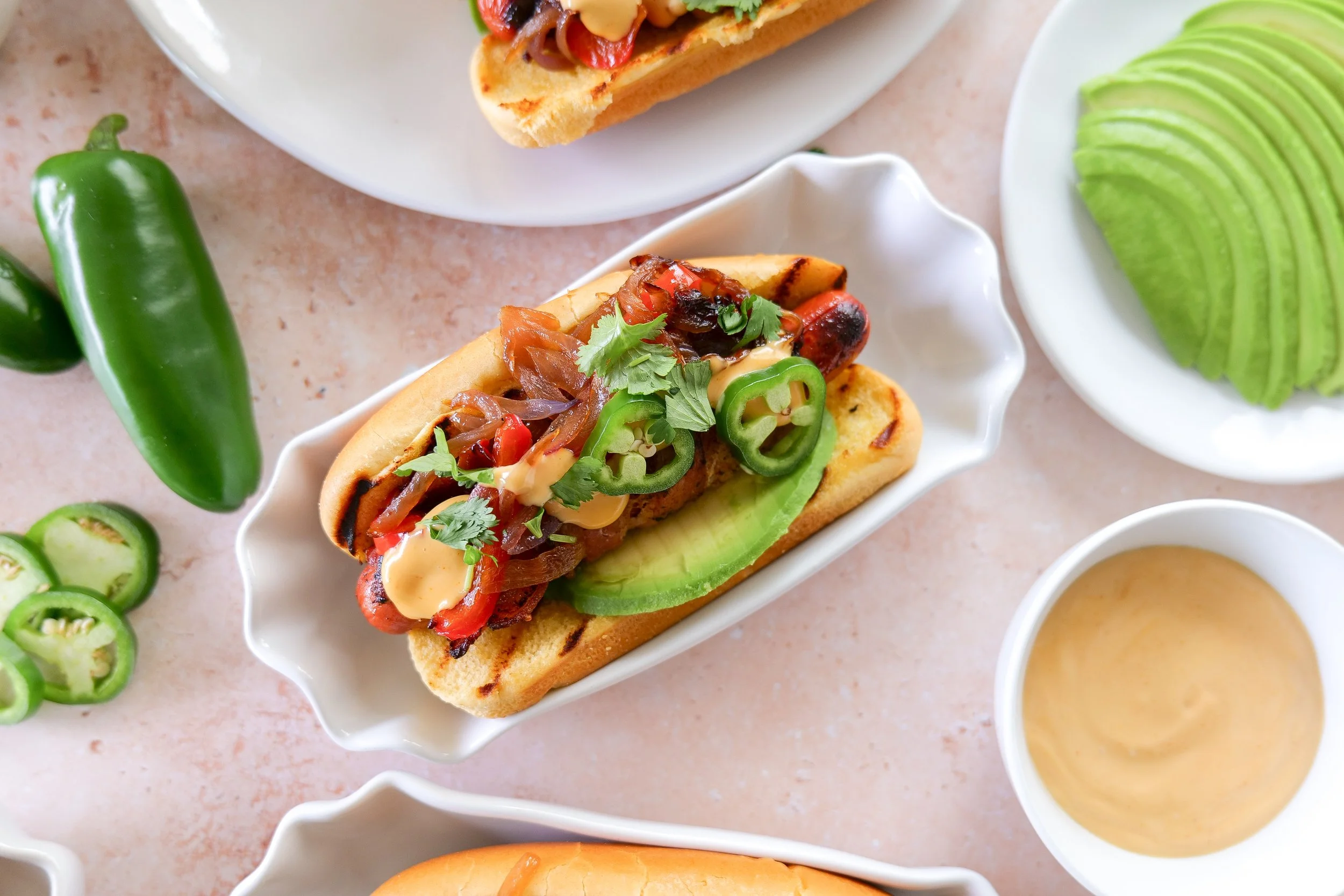 Bacon-wrapped hot dog served in a toasted bun