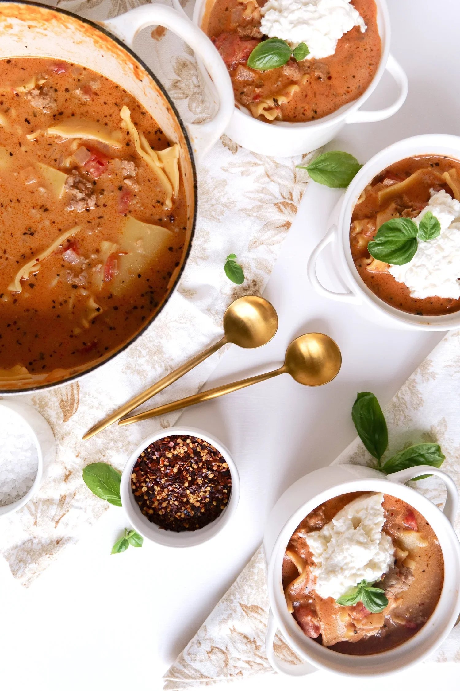 Comforting one-pot lasagna soup portioned as an easy make-ahead meal.