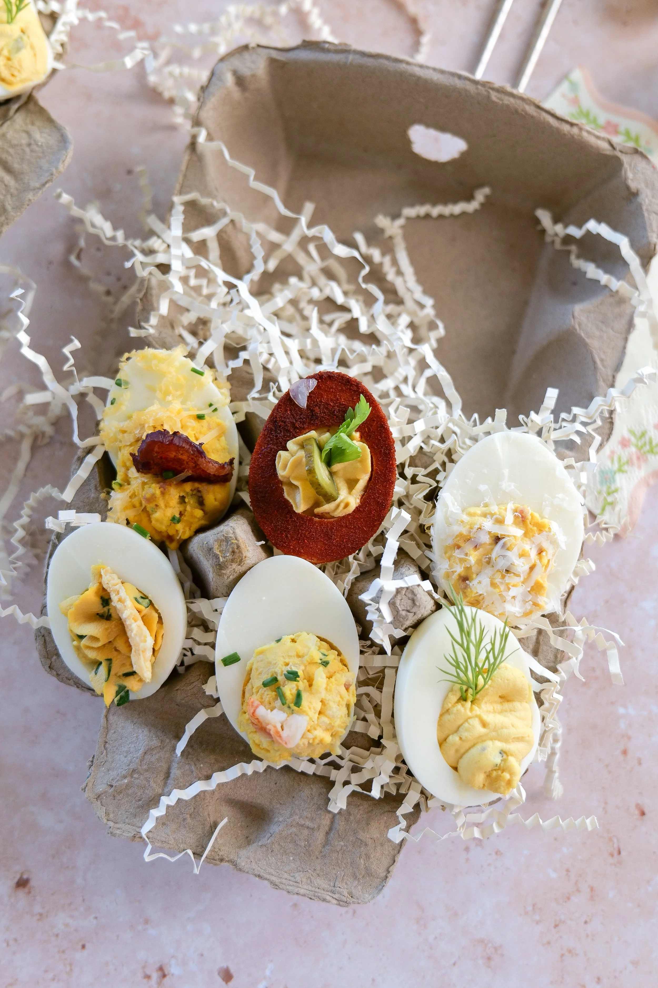Caesar salad deviled eggs topped with parmesan crisps and parsley