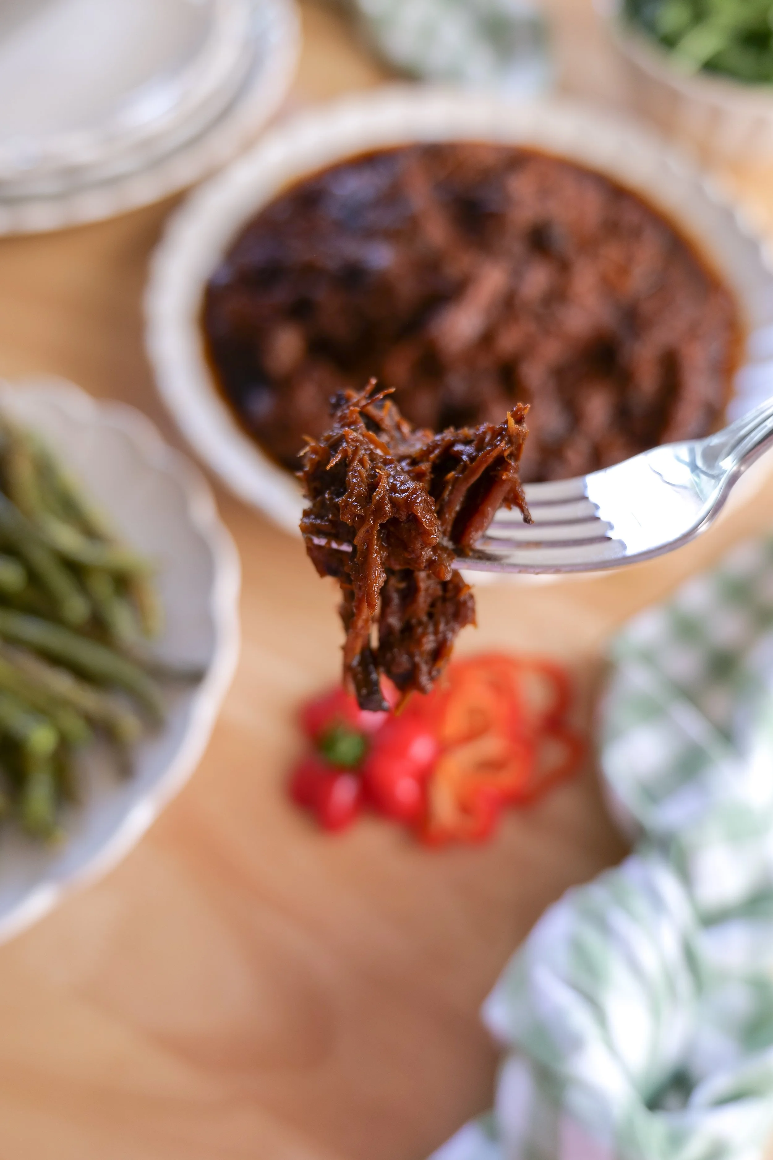 Easy slow cooker brisket cooked until tender and easy to pull apart.