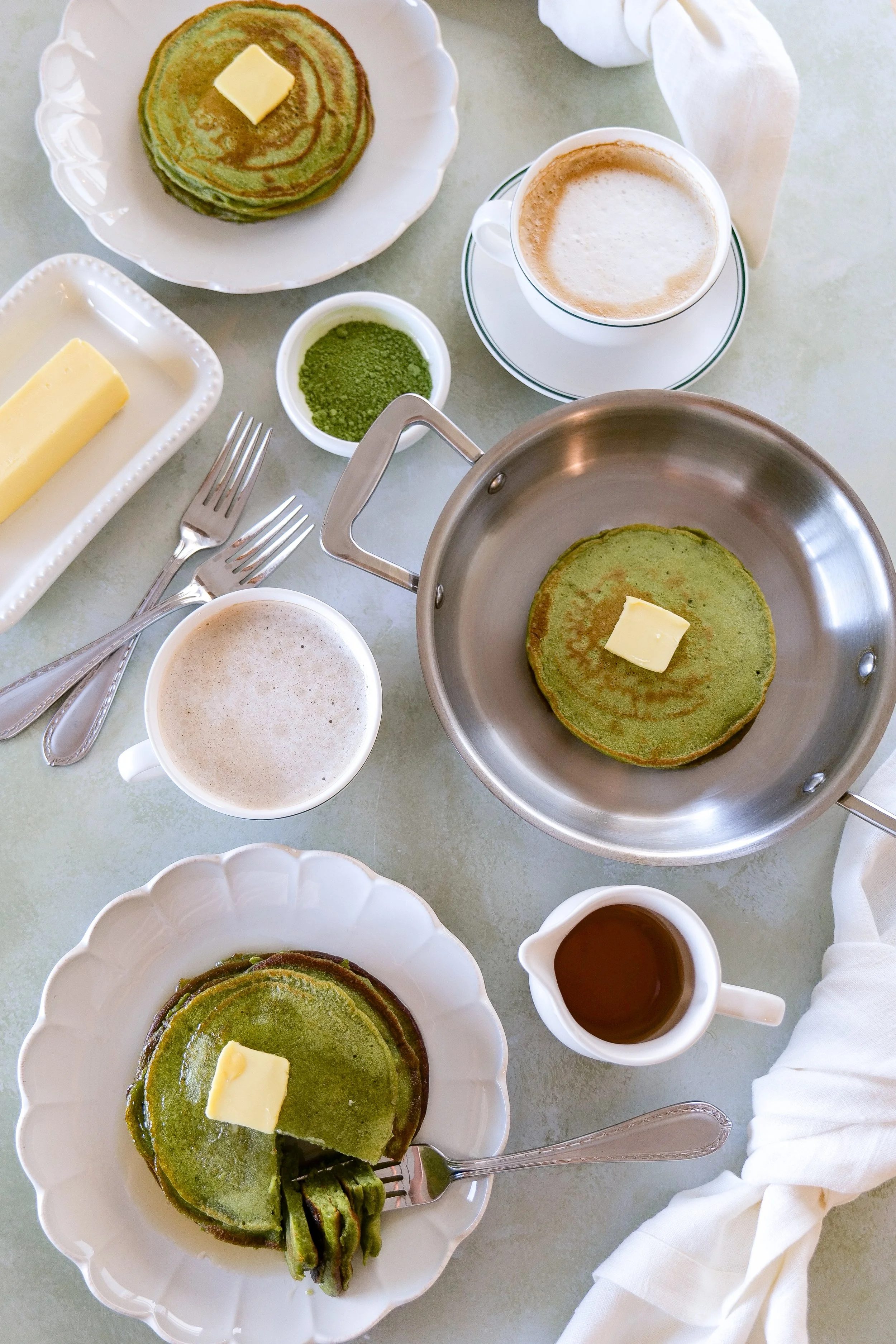 Breakfast scene featuring fluffy matcha sourdough discard pancakes