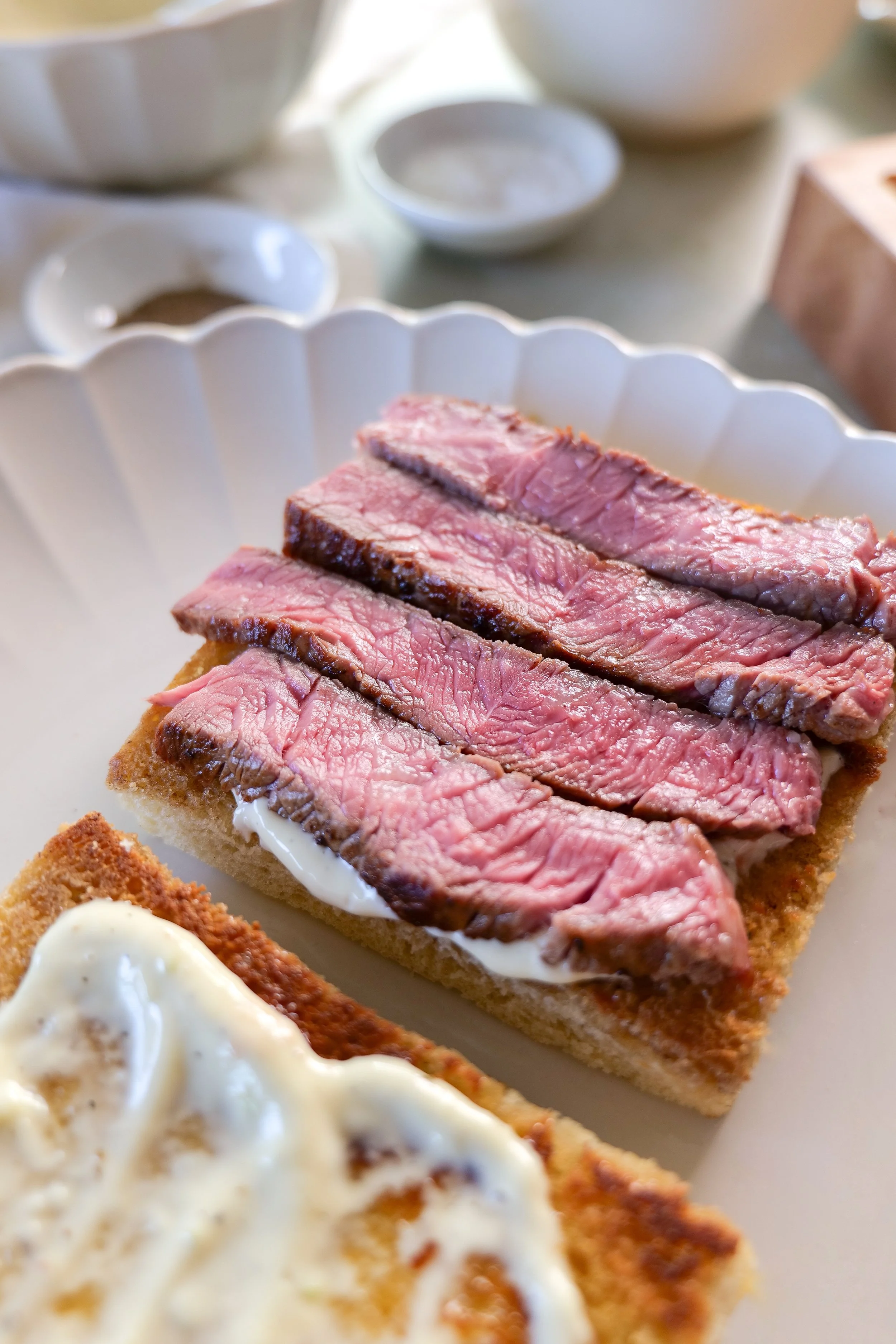 Steak sandwich layered with provolone and caramelized onions