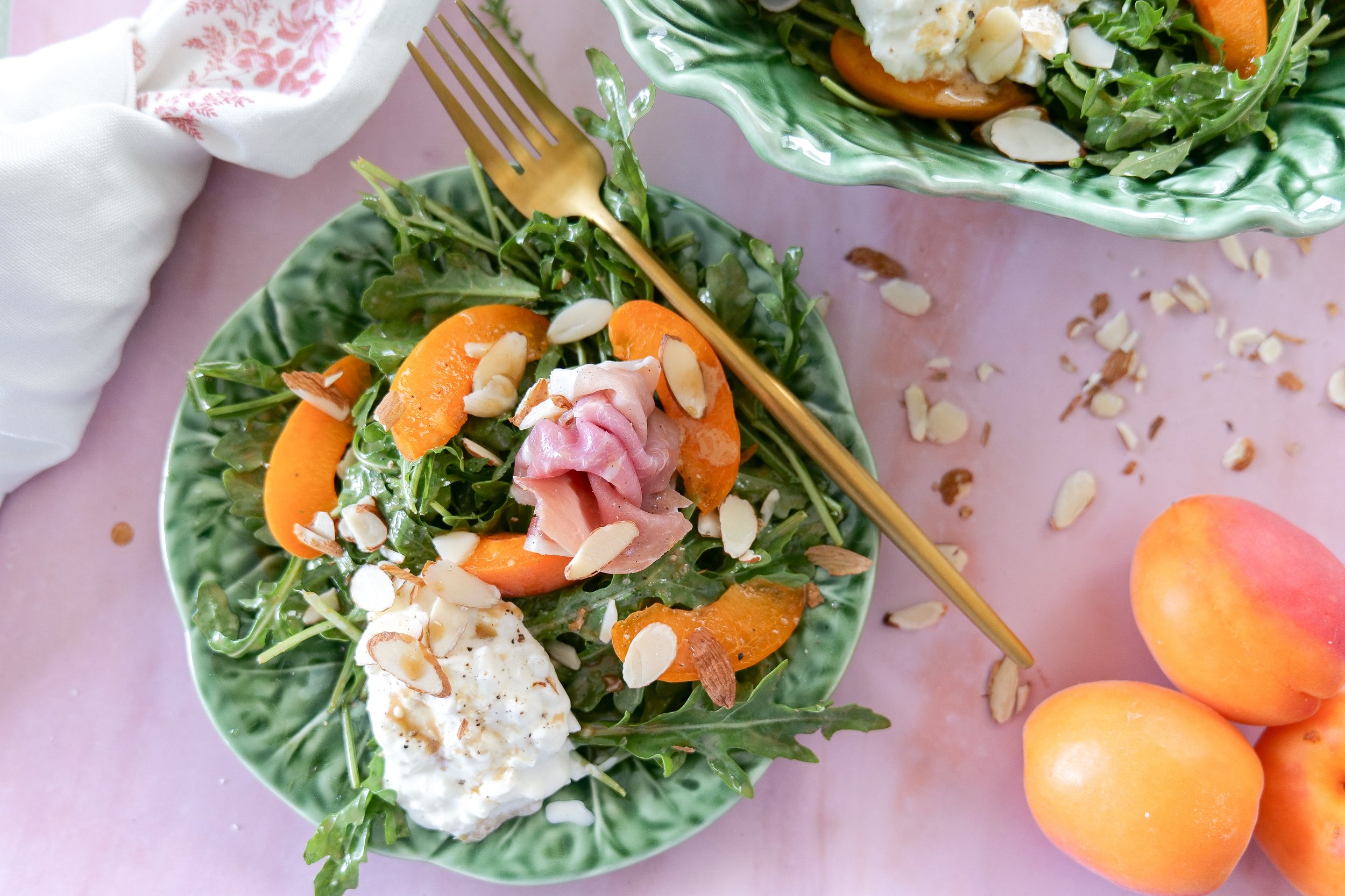 Cozy summer salad recipe with burrata, apricots, and arugula.