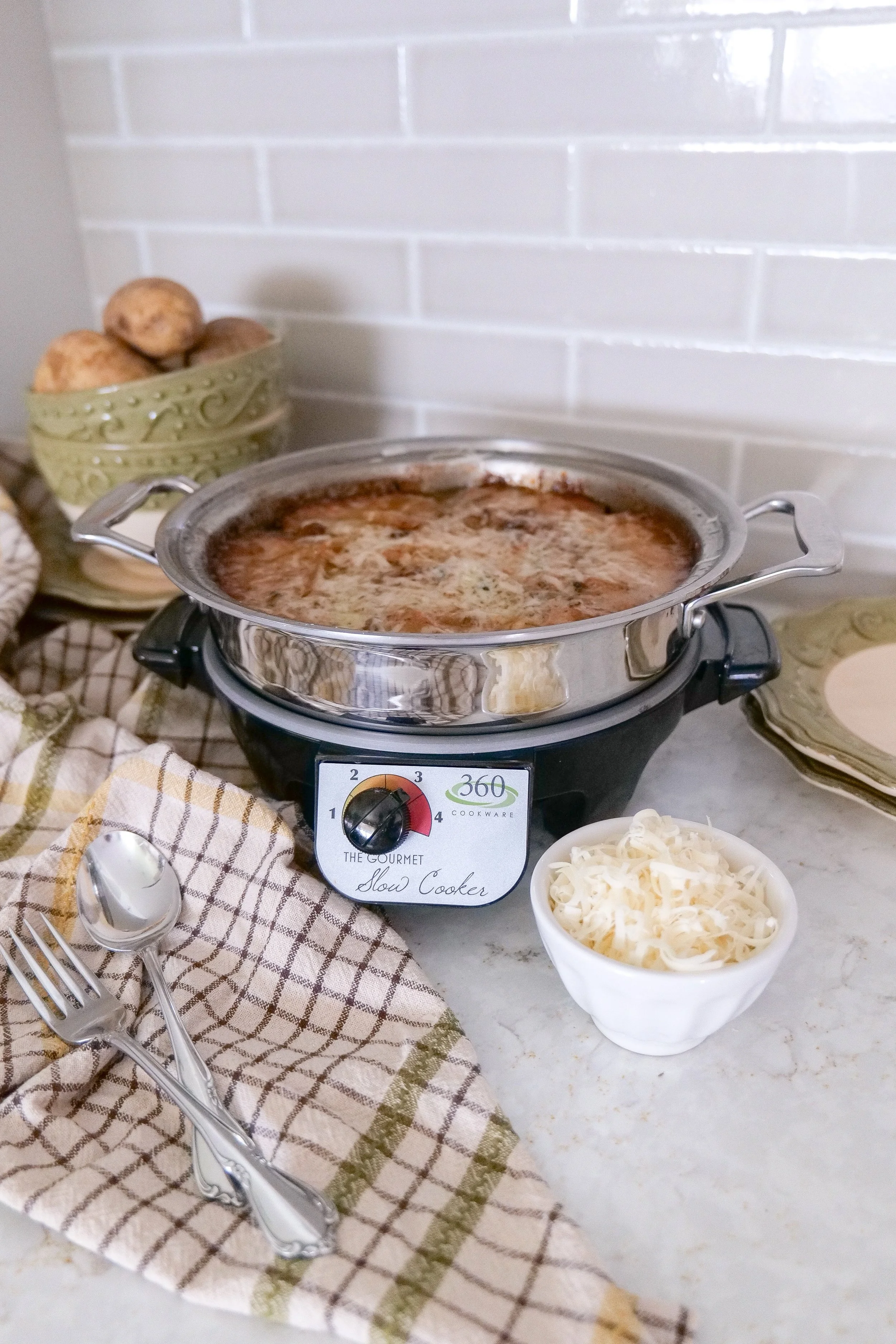 Cheesy potato casserole cooked low and slow in the crockpot.