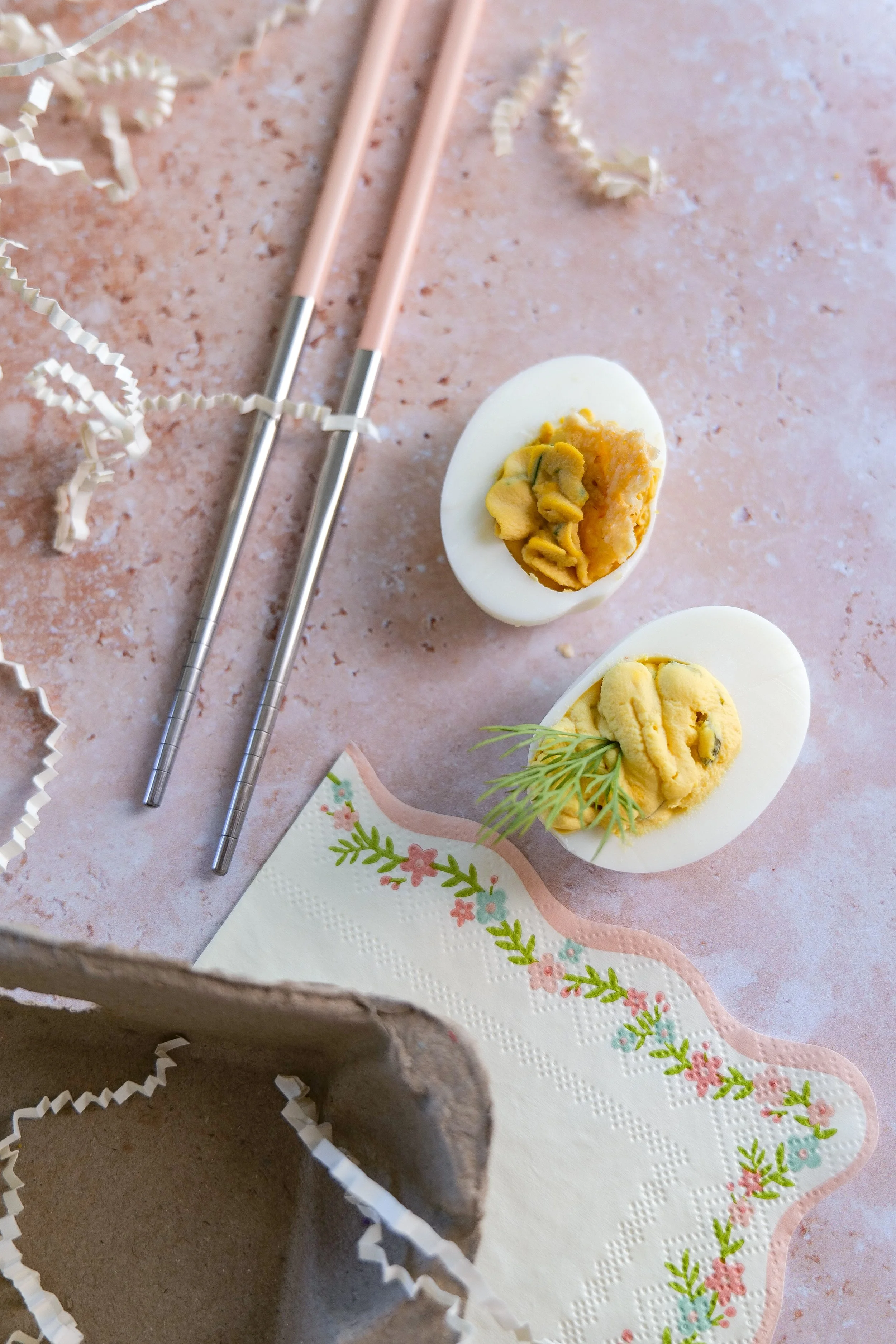 Dill pickle deviled eggs garnished with fresh dill and pickle slices