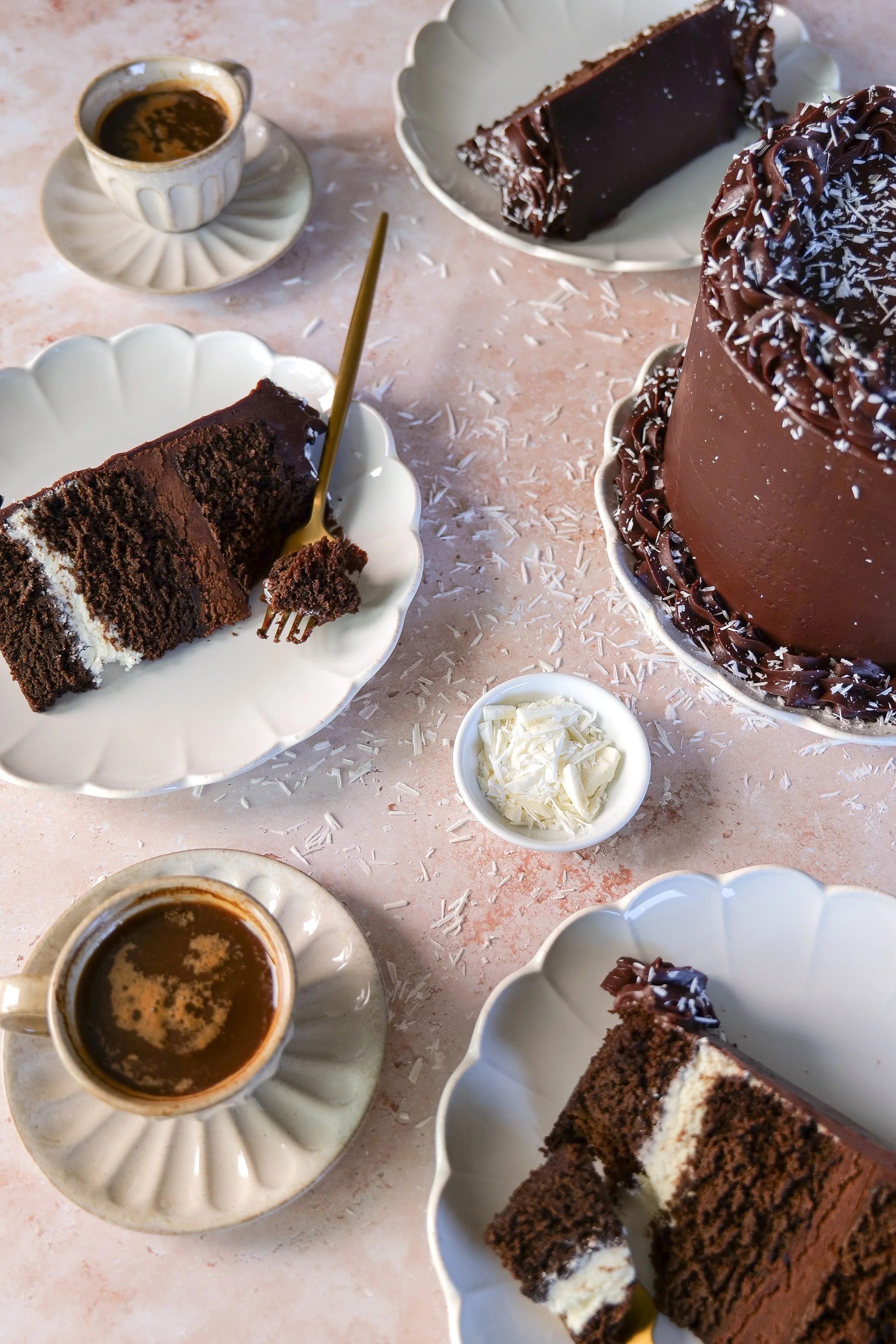 Slice of Tuxedo Cake showing chocolate cake, white chocolate mousse, and dark chocolate mousse layers.