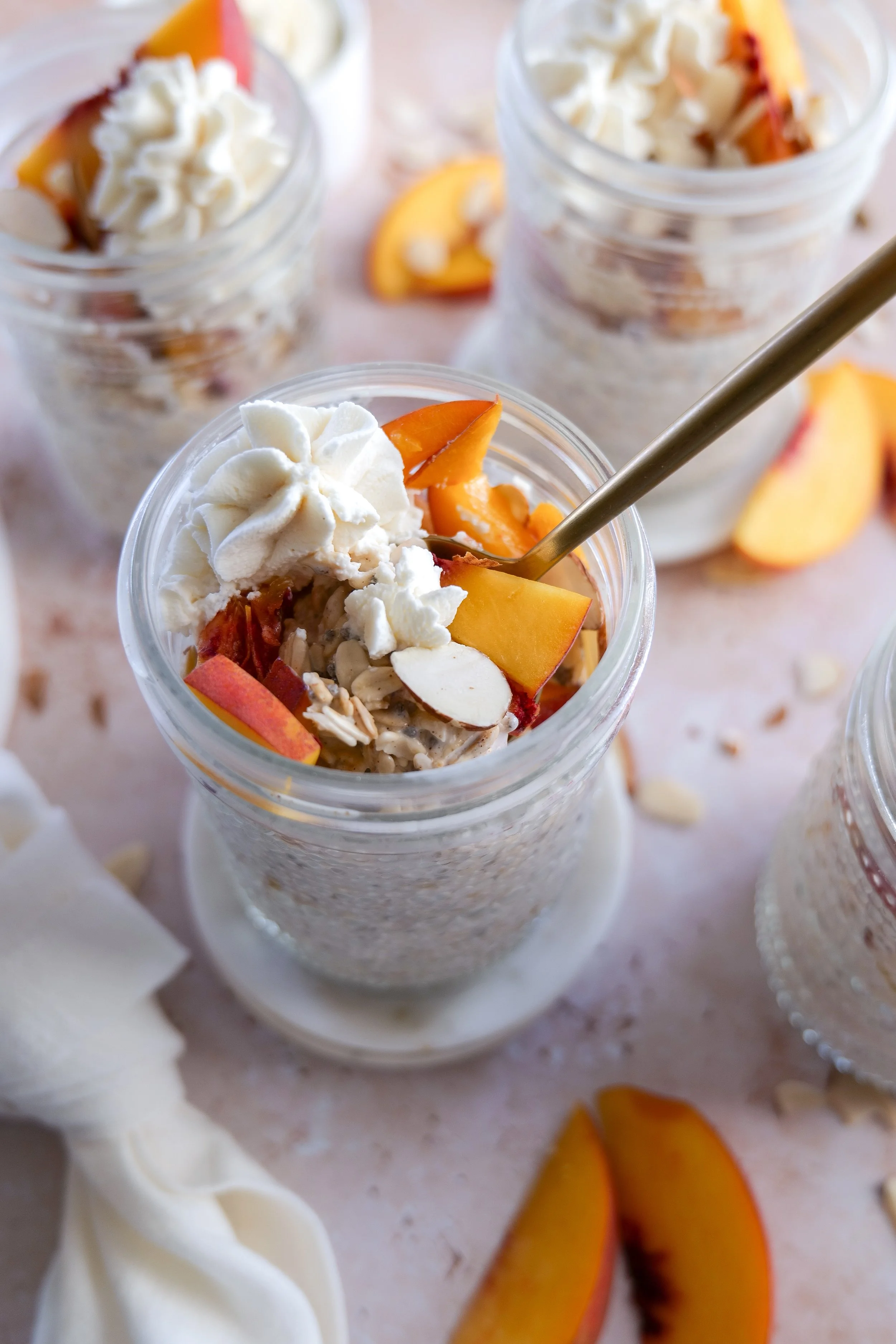 Close-up of creamy Peach Cobbler Overnight Oats made with fresh peaches and cinnamon.