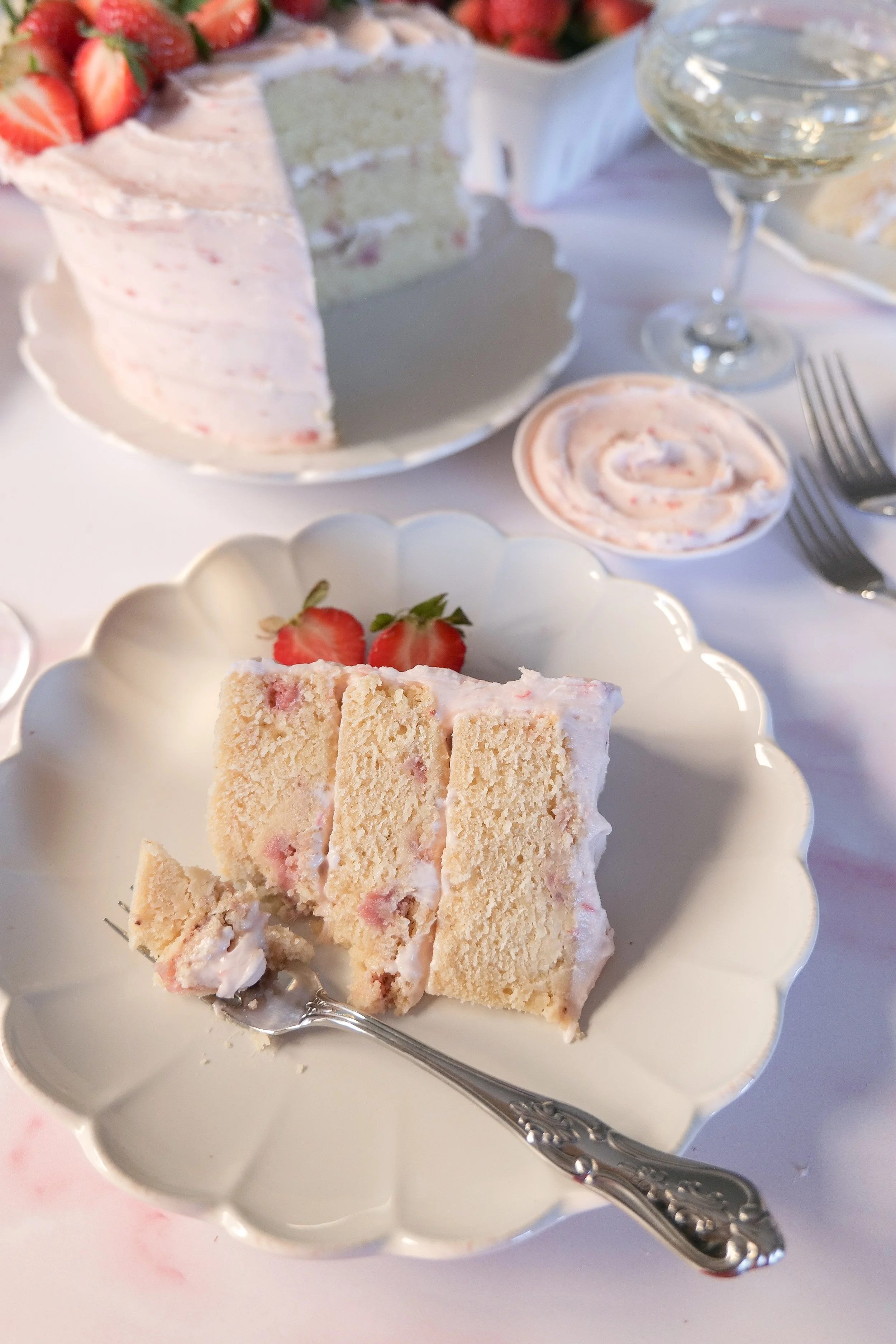 Strawberry Champagne Cake styled as an elegant homemade birthday or celebration cake.