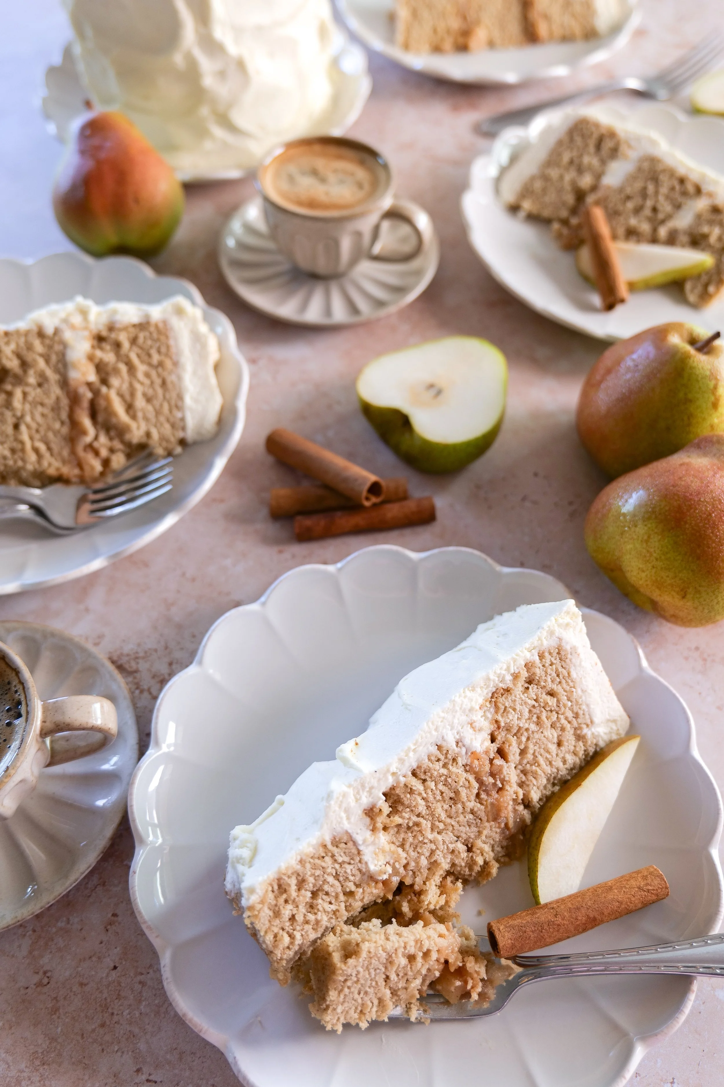 Fresh pear brown butter cake covered in whipped vanilla mascarpone cream.