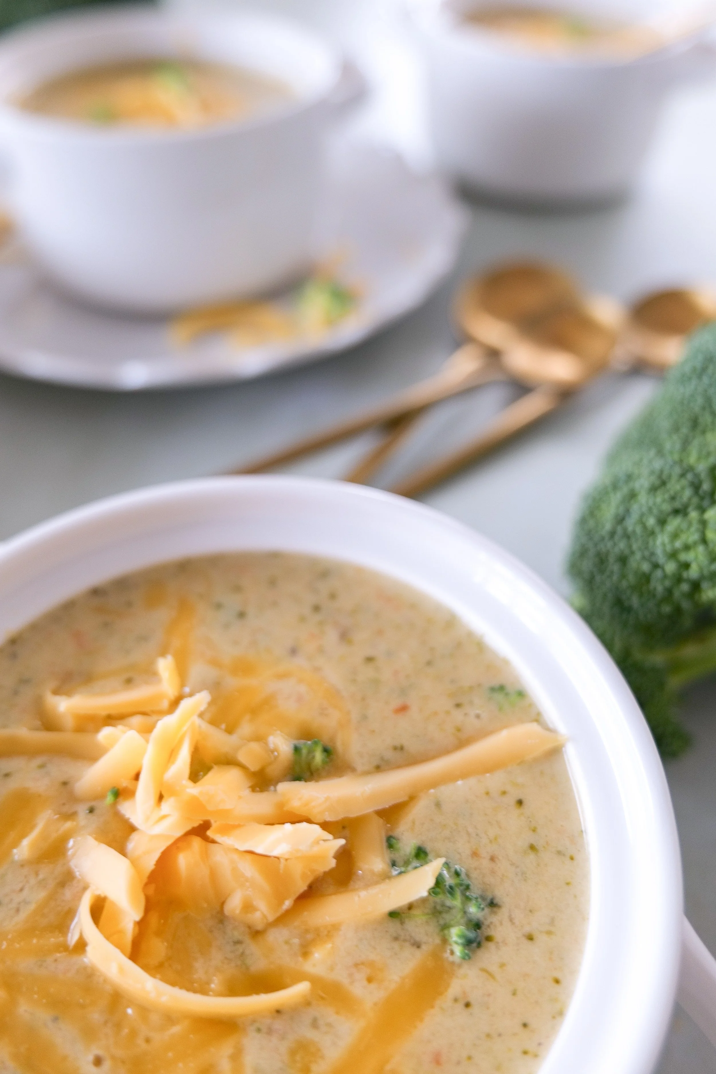 Homemade broccoli cheddar soup from scratch served warm in a bowl.