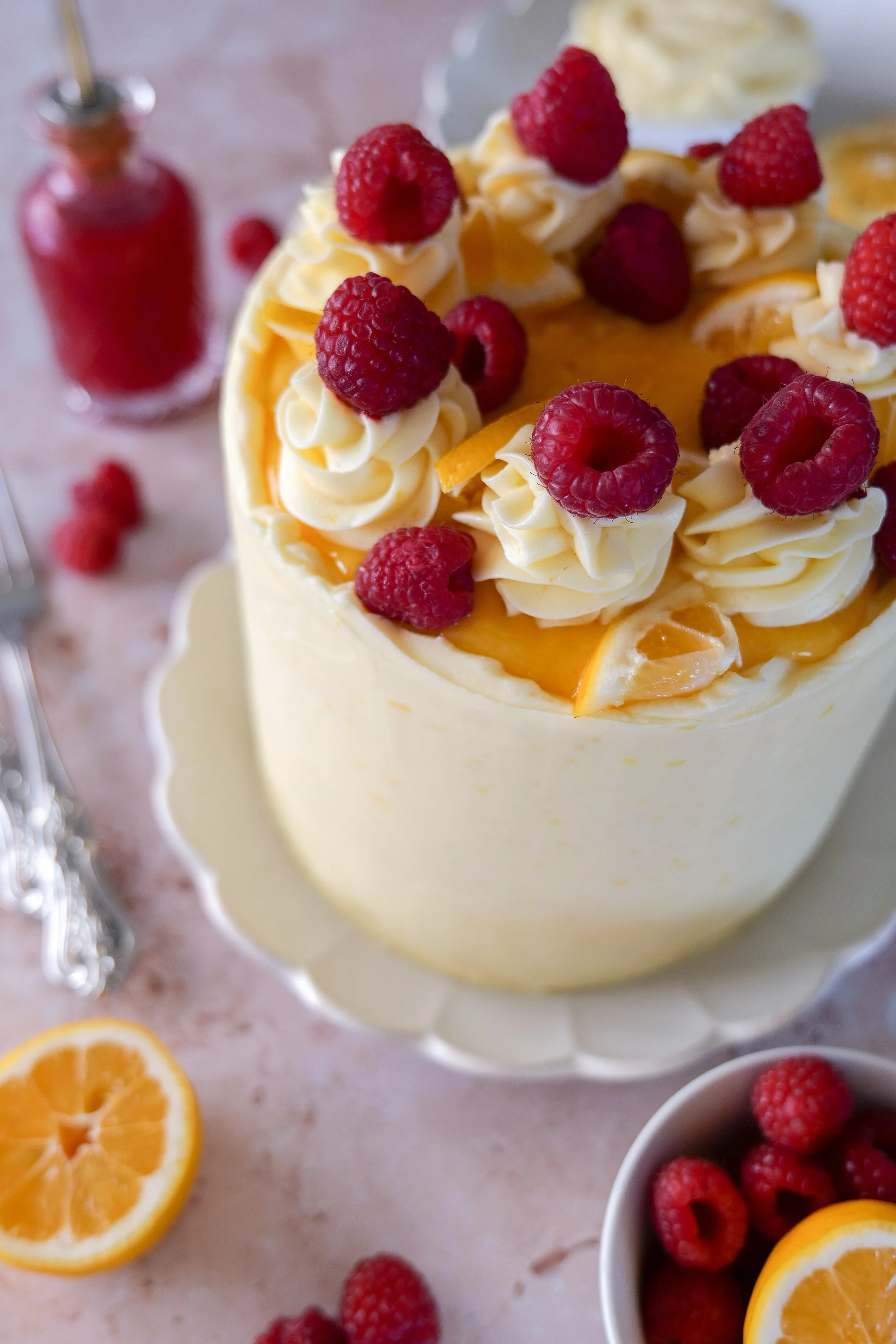 Lemon layer cake with raspberry filling and lemon curd center.