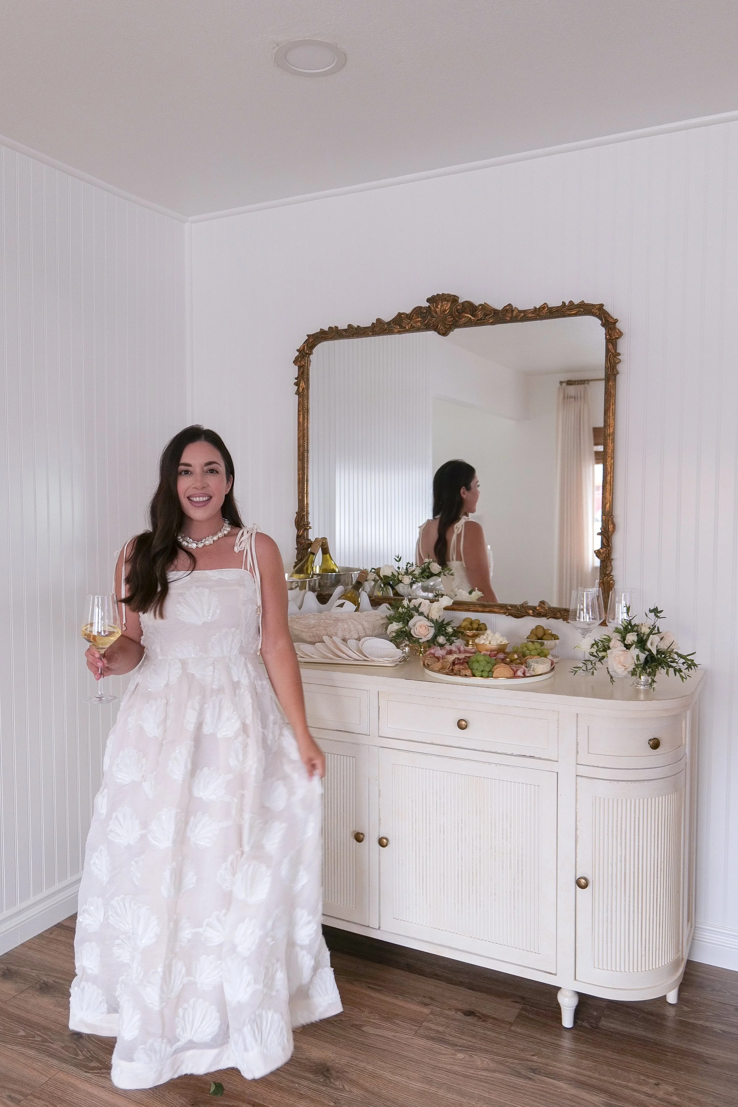 Chic coastal dinner outfit styled for summer entertaining at home